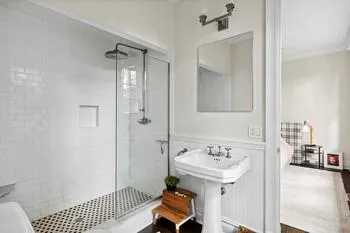 Bathroom with a shower with door