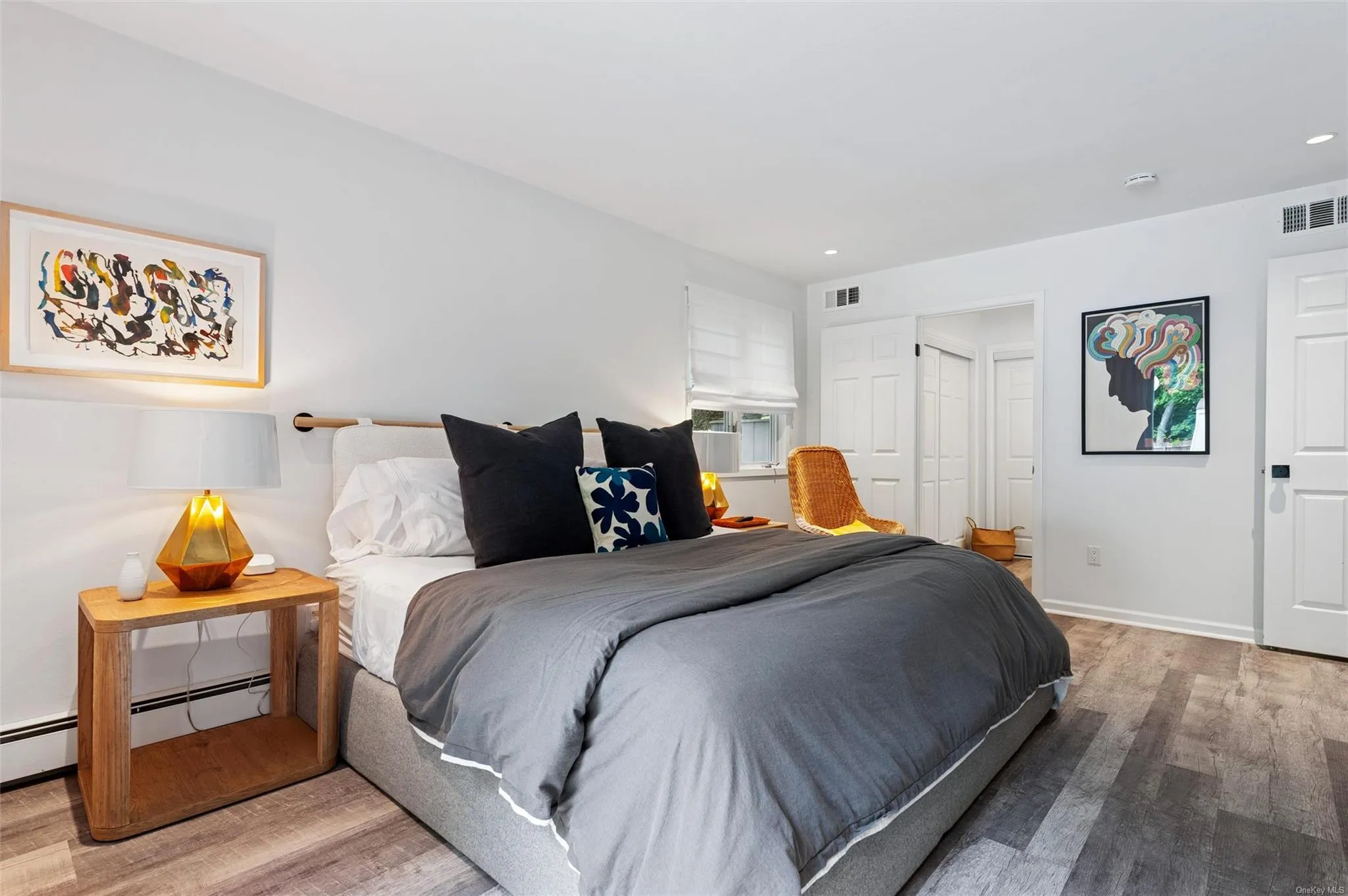 Bedroom featuring wood finished floors, baseboards, and recessed lighting Bedroom featuring wood finished floors, baseboards, and recessed lighting