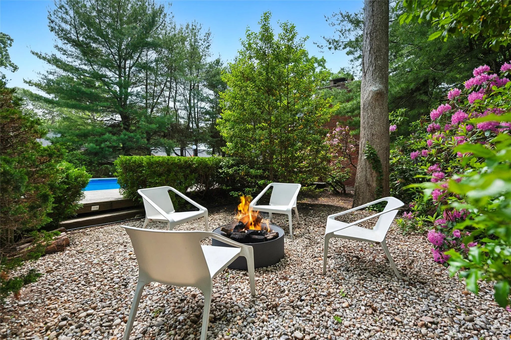 View of yard with a fire pit View of yard with a fire pit