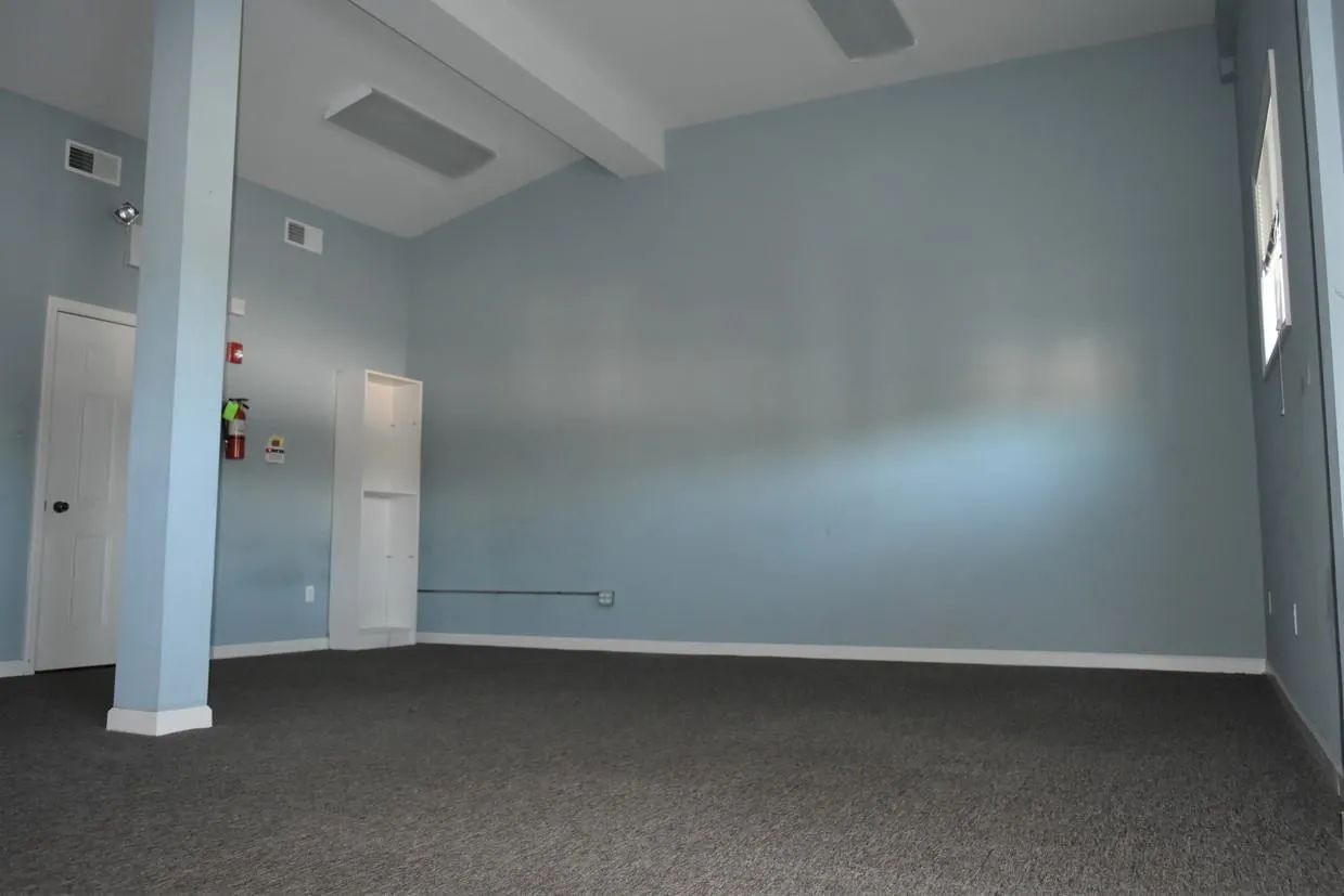 Carpeted spare room with lofted ceiling with beams Carpeted spare room with lofted ceiling with beams