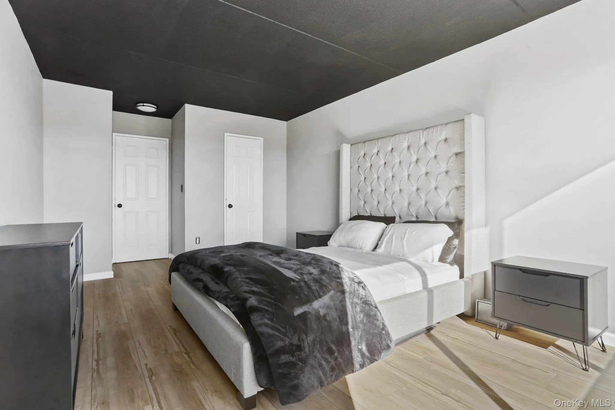 Spacious bedroom with 2 closets and ample natural light Spacious bedroom with 2 closets and ample natural light