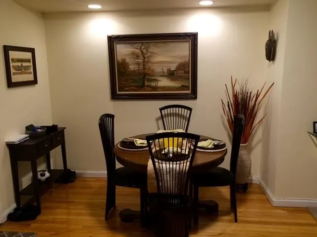 Dining room featuring light wood-type flooring Dining room featuring light wood-type flooring