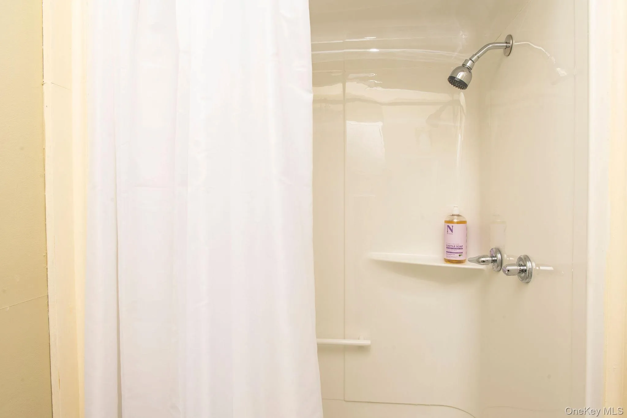 Full bathroom with shower, in-unit washer and dryer, and convenient everyday functionality. Full bathroom with shower, in-unit washer and dryer, and convenient everyday functionality.