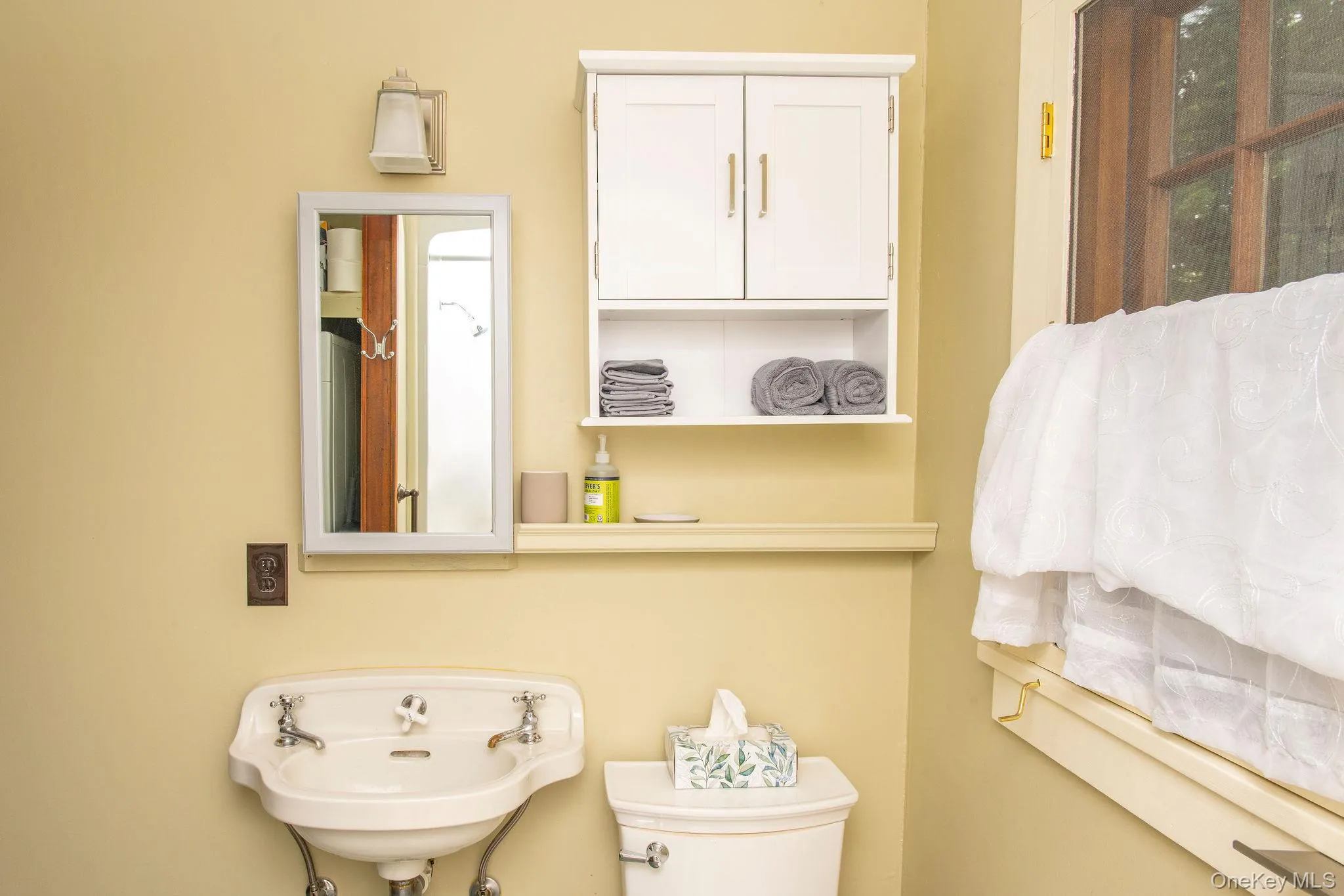 Full bathroom with shower, in-unit washer and dryer, and convenient everyday functionality. Full bathroom with shower, in-unit washer and dryer, and convenient everyday functionality.