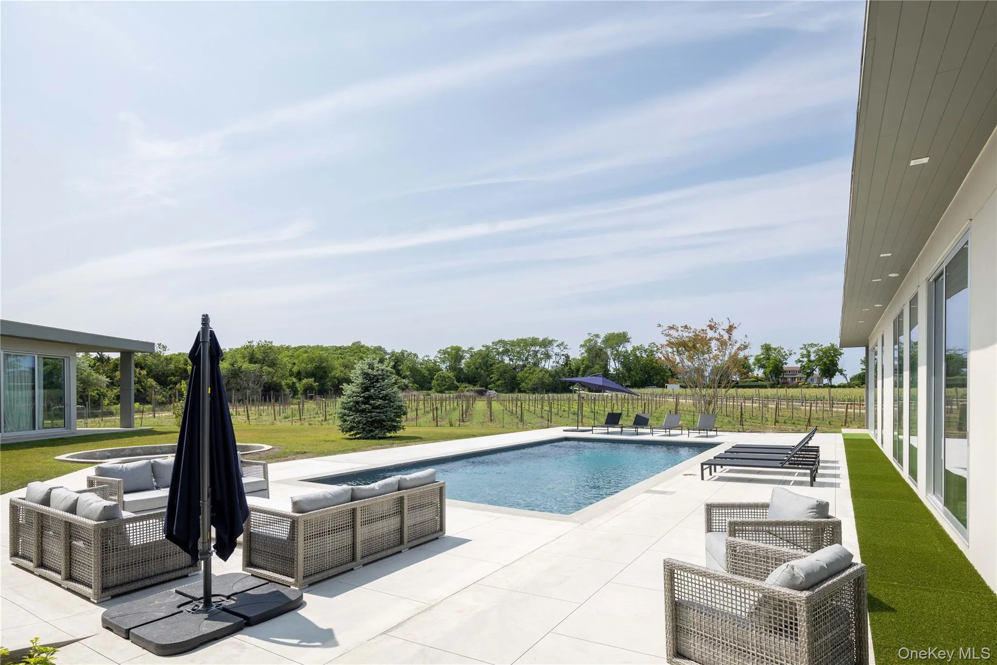 View of pool featuring a patio area View of pool featuring a patio area
