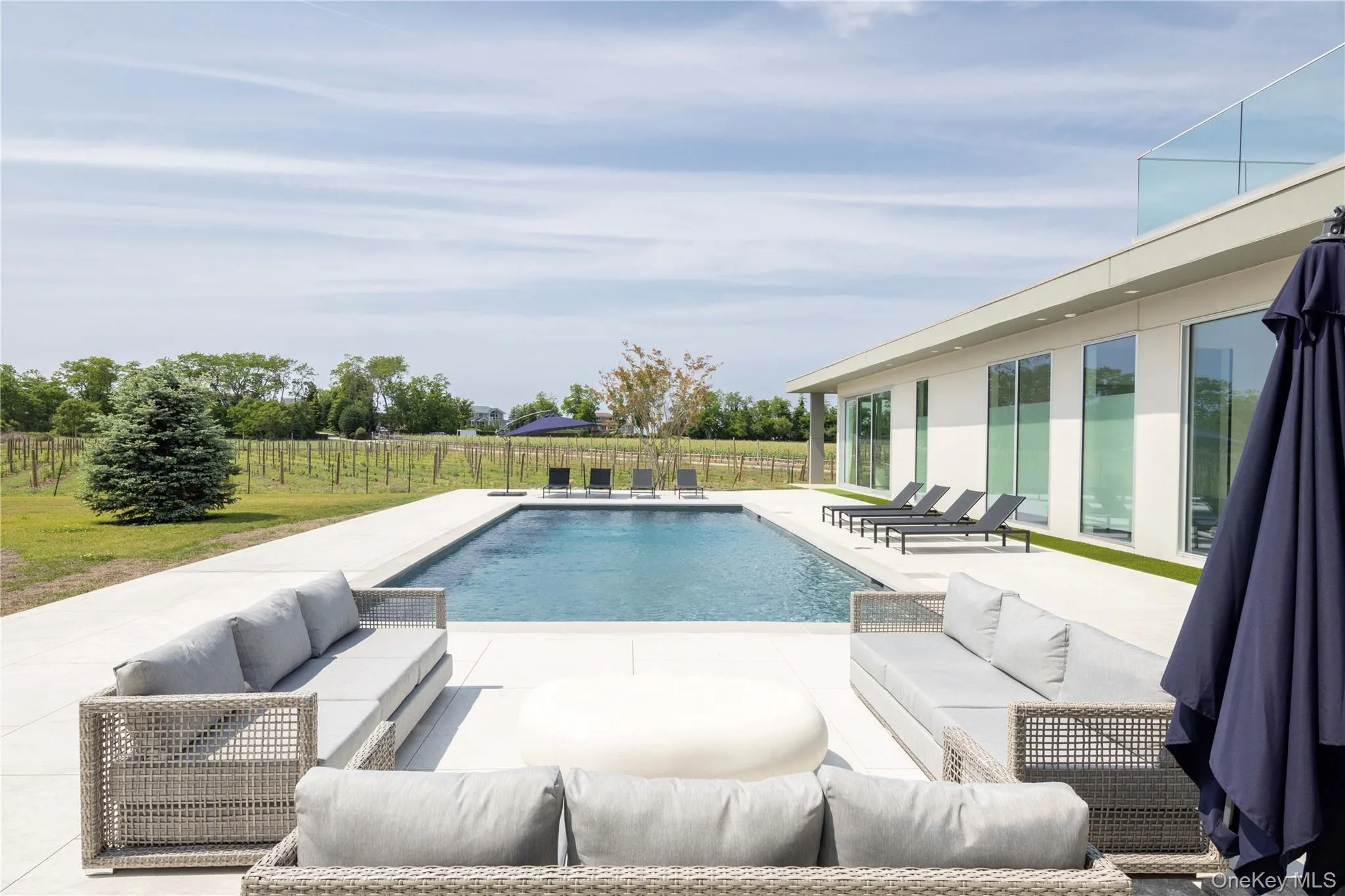 View of swimming pool featuring a patio and an outdoor hangout area View of swimming pool featuring a patio and an outdoor hangout area