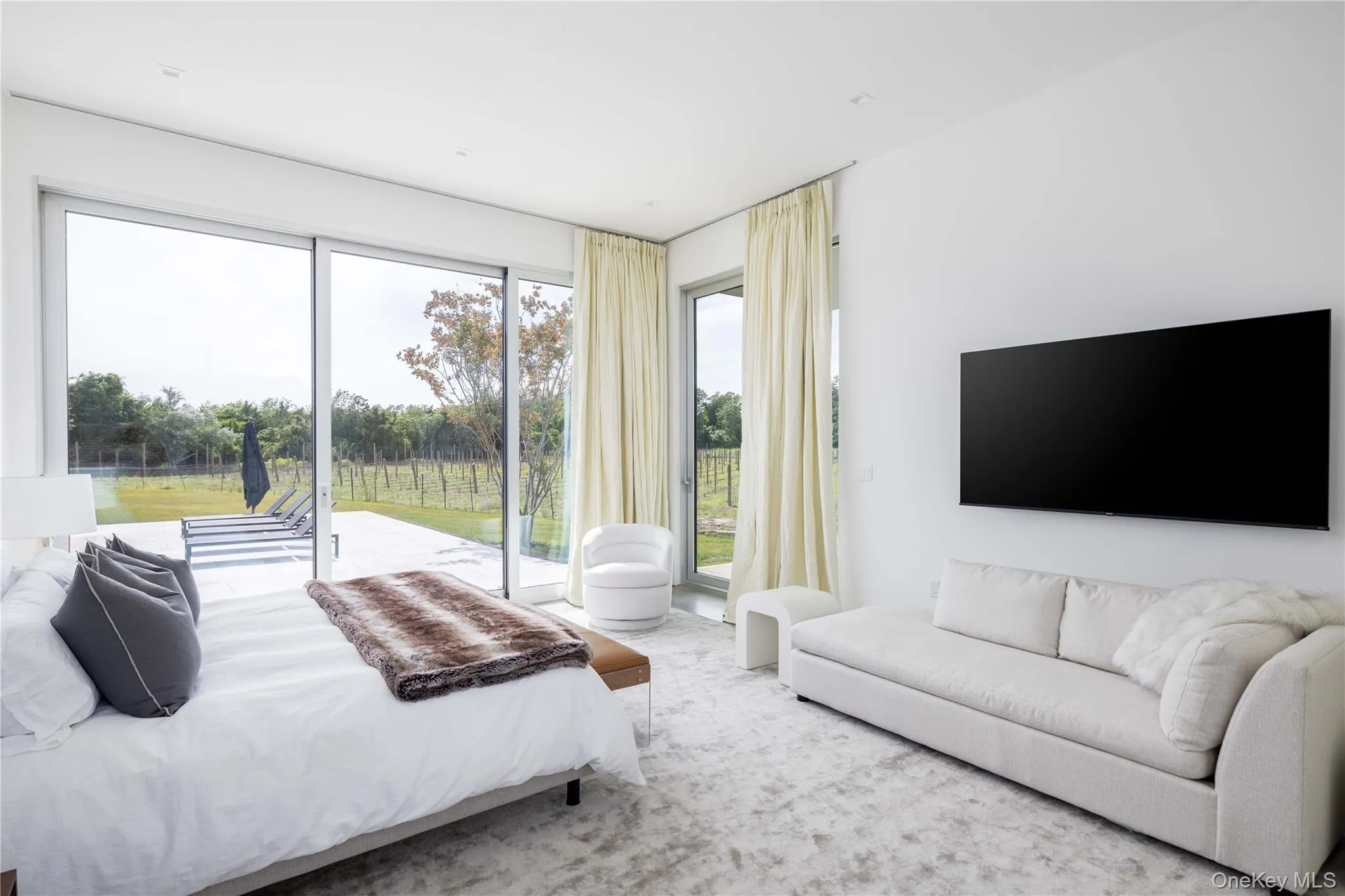 Bedroom featuring access to outside and carpet floors Bedroom featuring access to outside and carpet floors