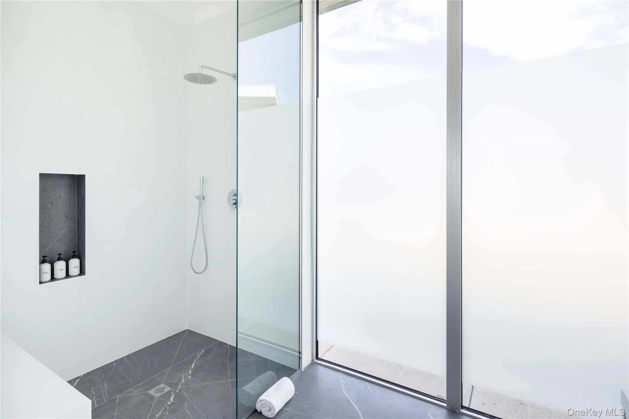 Bathroom featuring a shower Bathroom featuring a shower