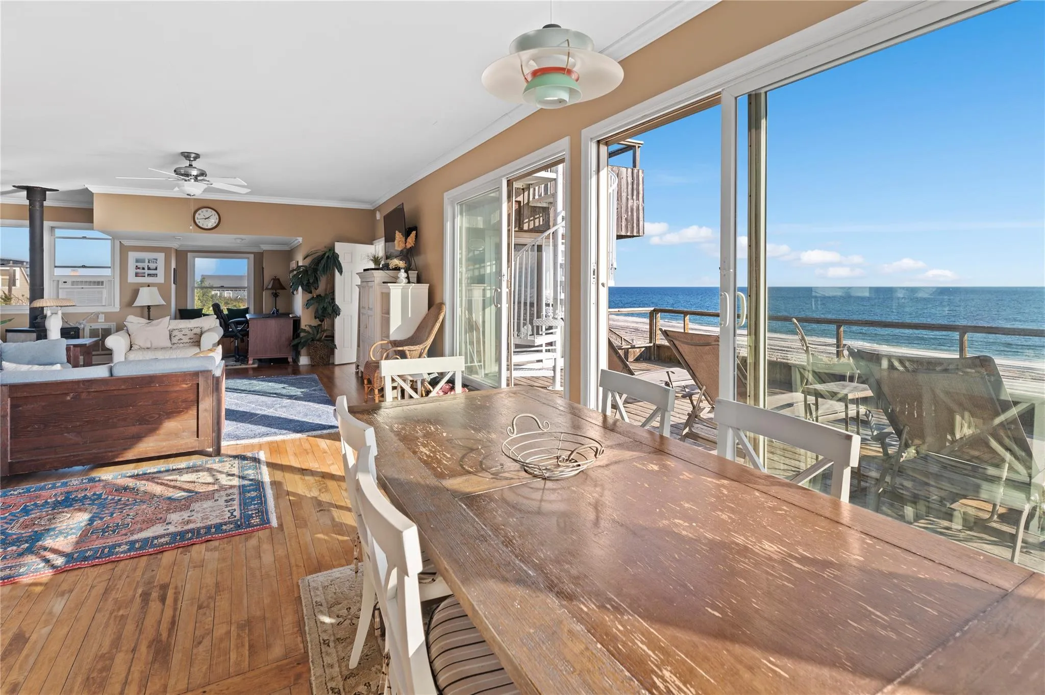 Dining space featuring hardwood / wood-style flooring, ceiling fan, and crown molding Dining space featuring hardwood / wood-style flooring, ceiling fan, and crown molding