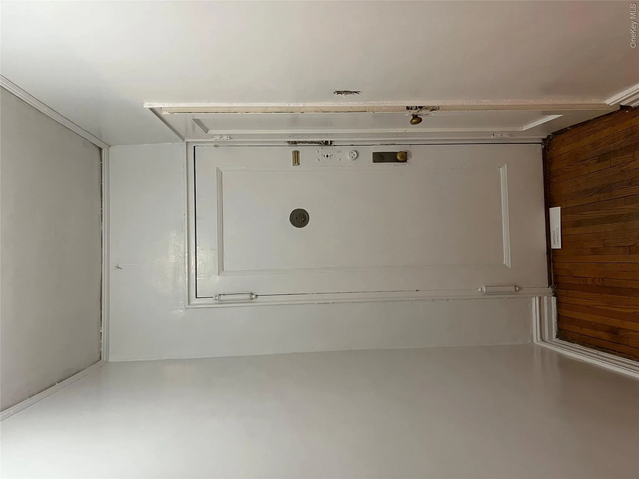 Doorway to outside with dark hardwood / wood-style flooring Doorway to outside with dark hardwood / wood-style flooring