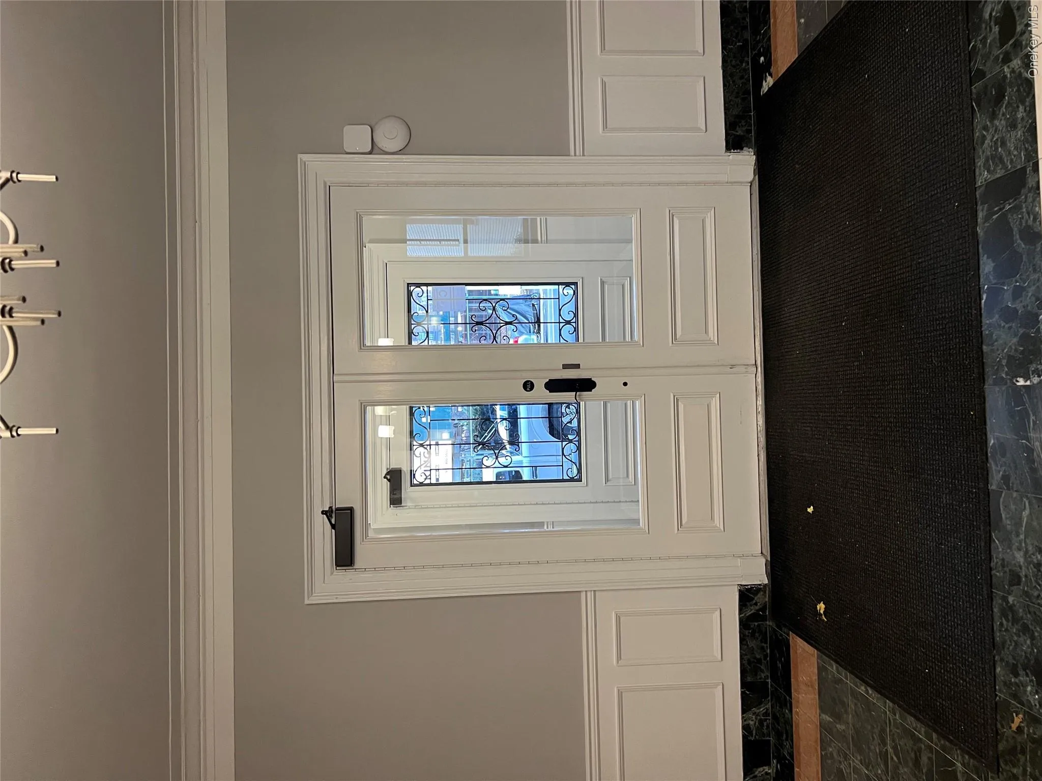 Doorway to outside with french doors and ornamental molding Doorway to outside with french doors and ornamental molding