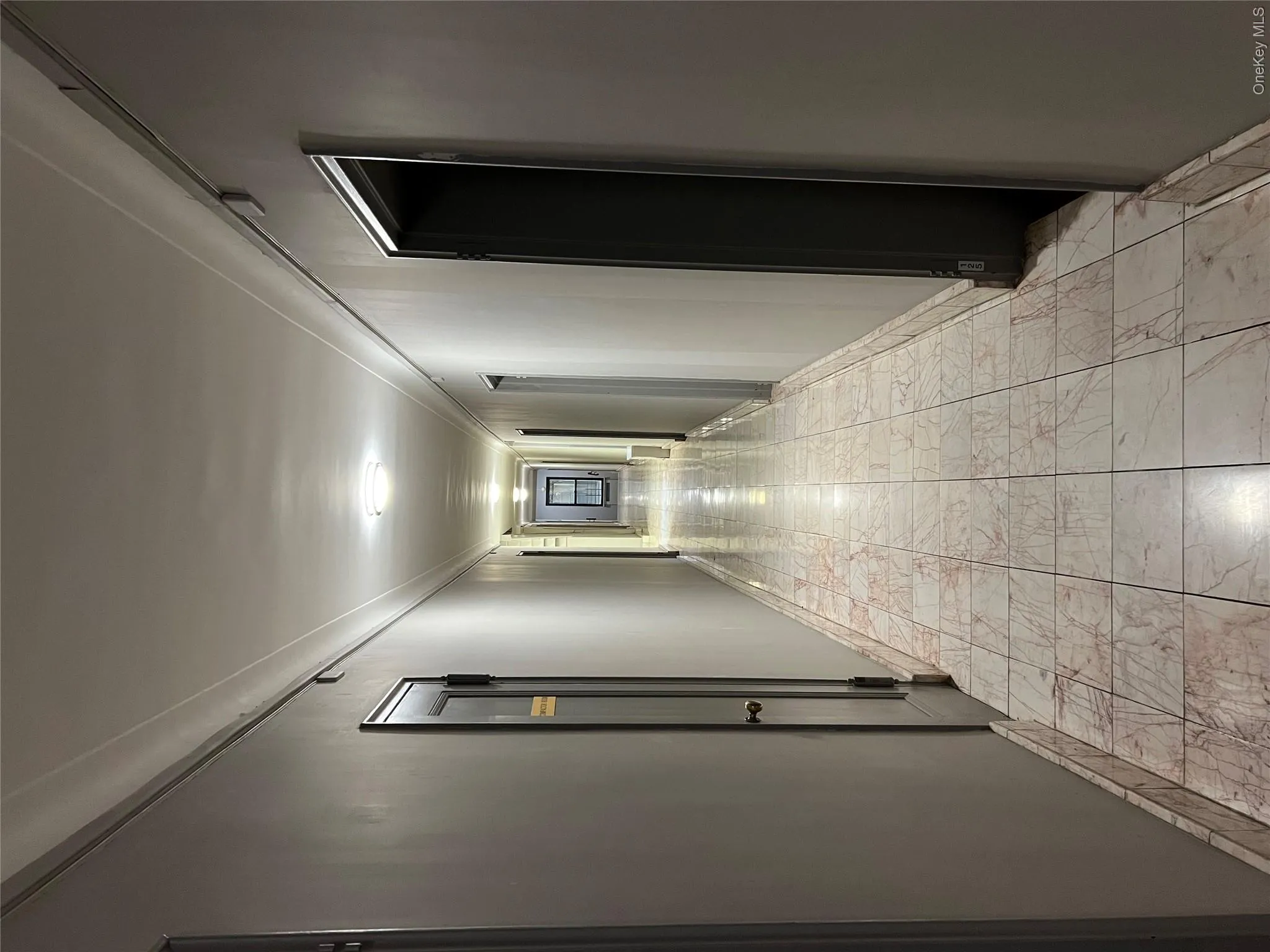 Hallway featuring crown molding Hallway featuring crown molding