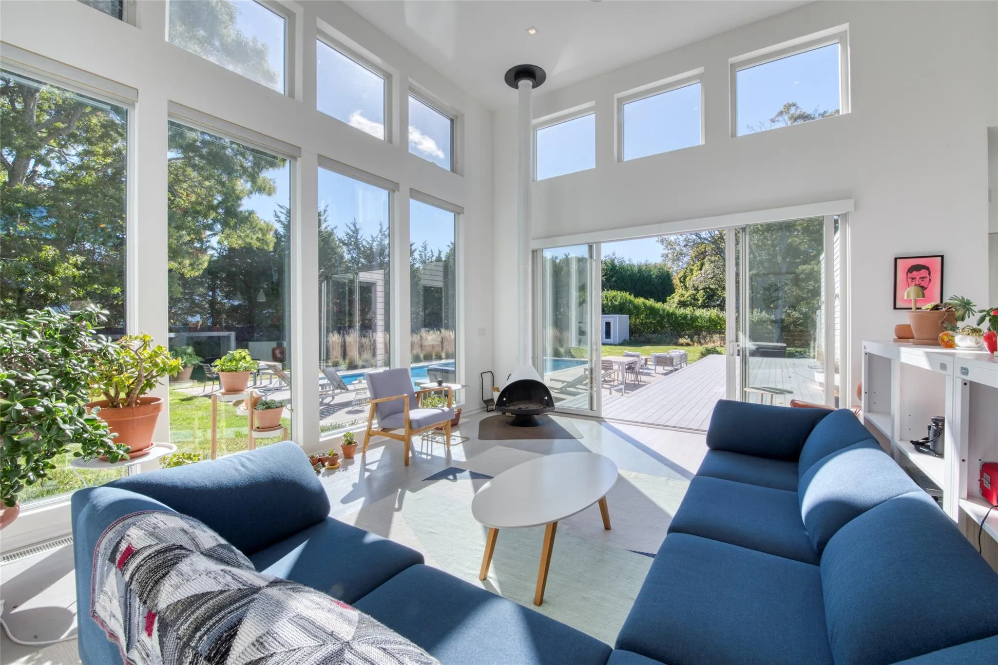 Living room featuring a high ceiling Living room featuring a high ceiling