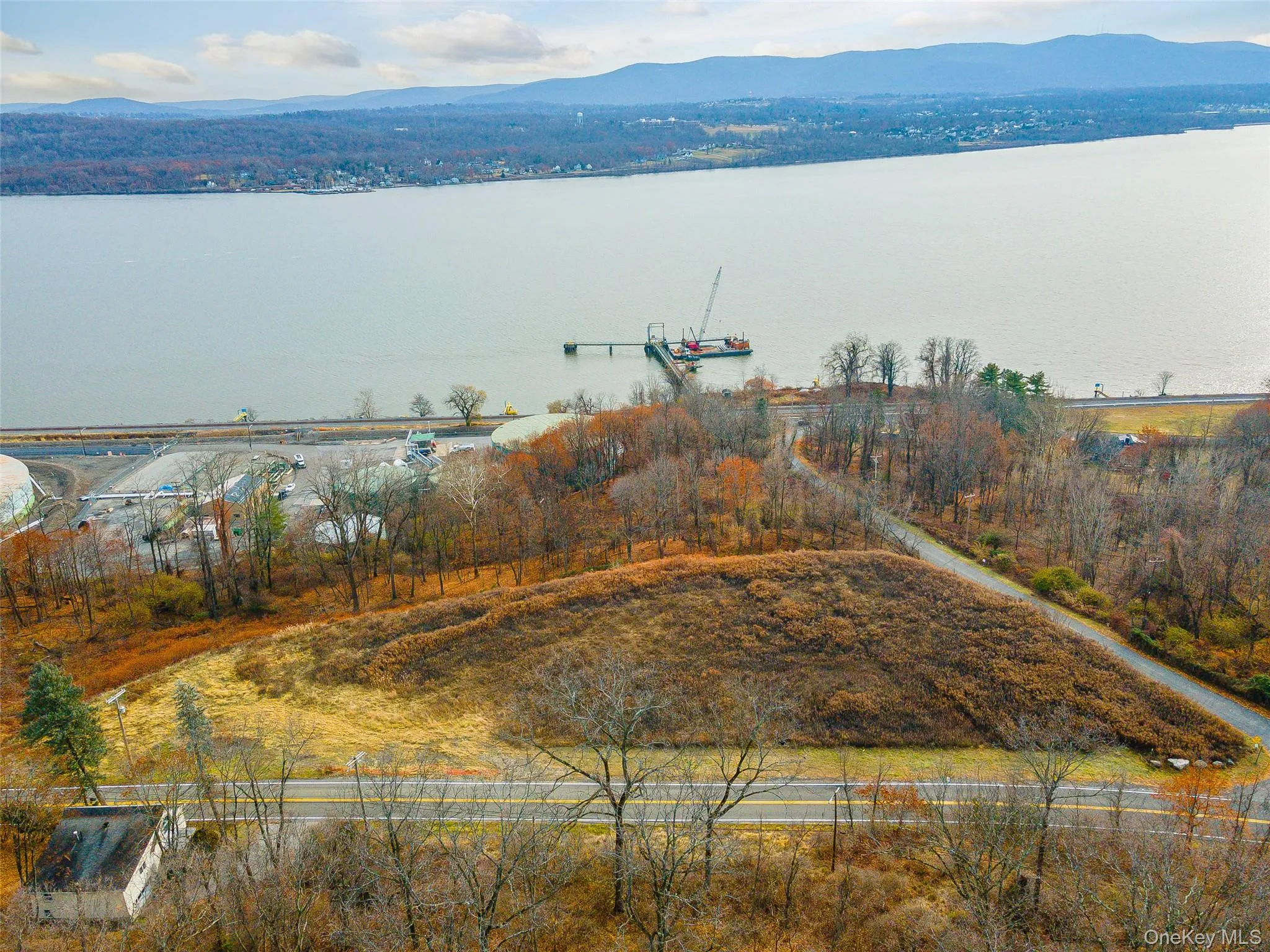 Aerial view with a water and mountain view Aerial view with a water and mountain view