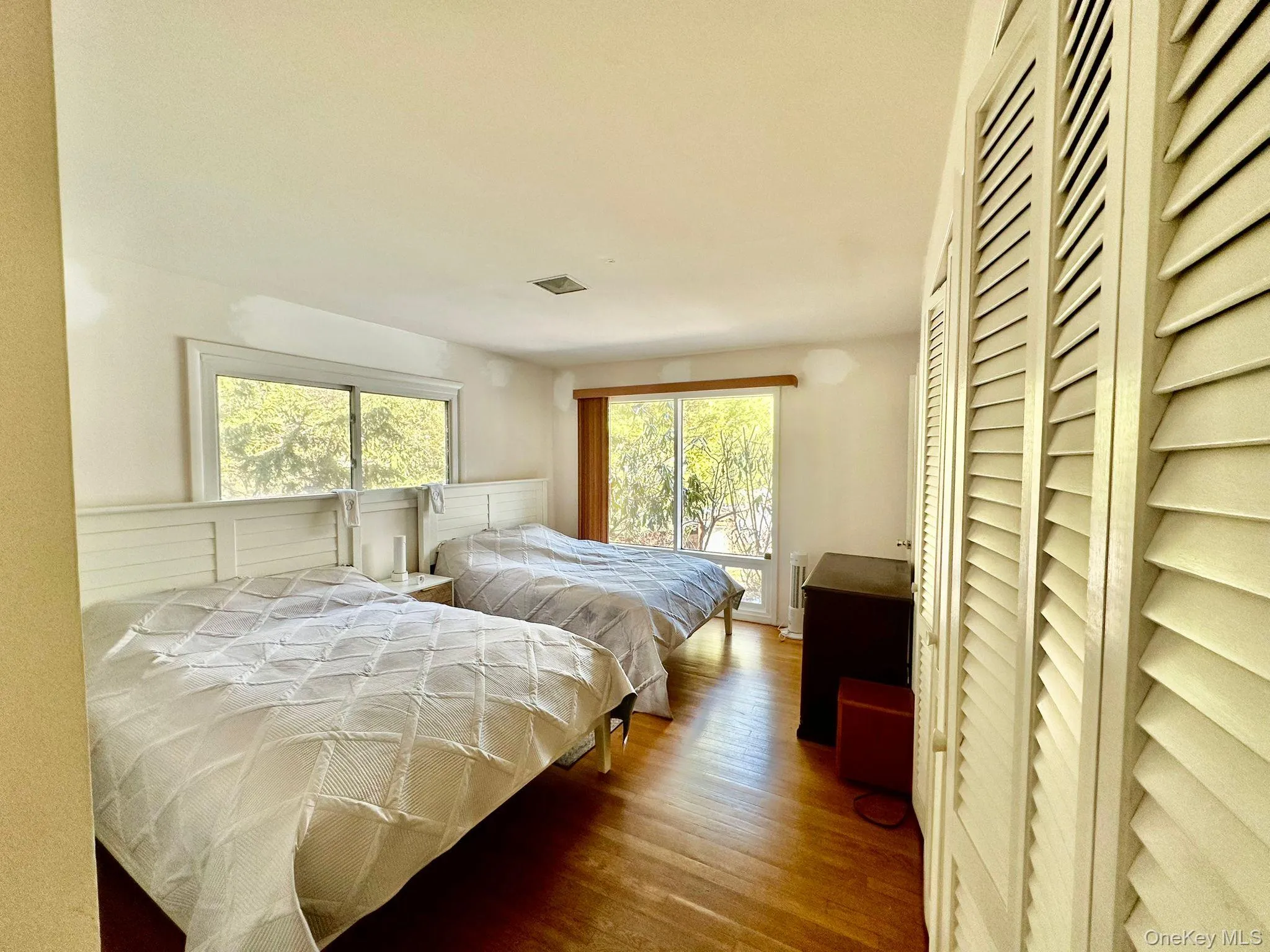 Bedroom featuring wood-type flooring Bedroom featuring wood-type flooring