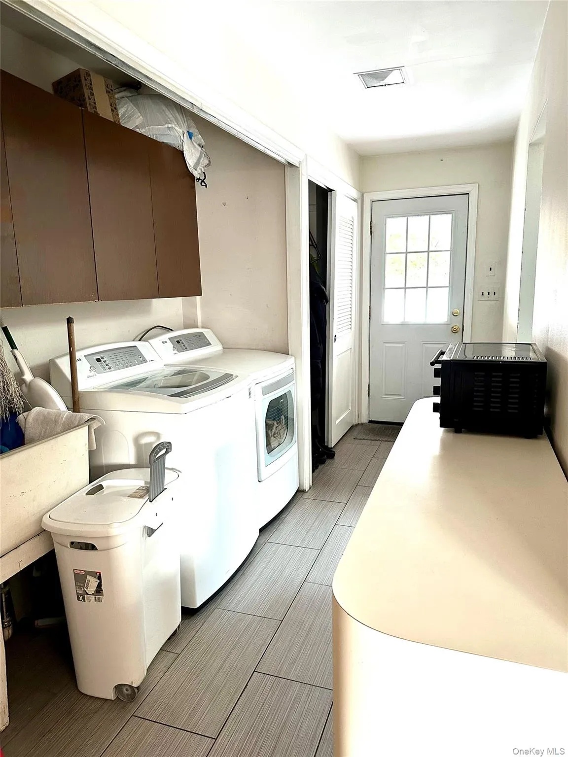 Laundry room with washer and clothes dryer Laundry room with washer and clothes dryer