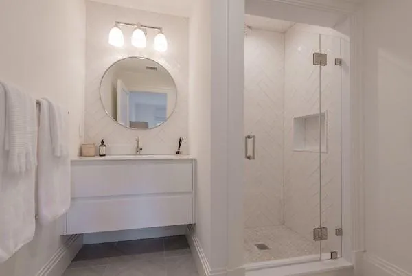 Bathroom with tile patterned floors, vanity, and walk in shower Bathroom with tile patterned floors, vanity, and walk in shower