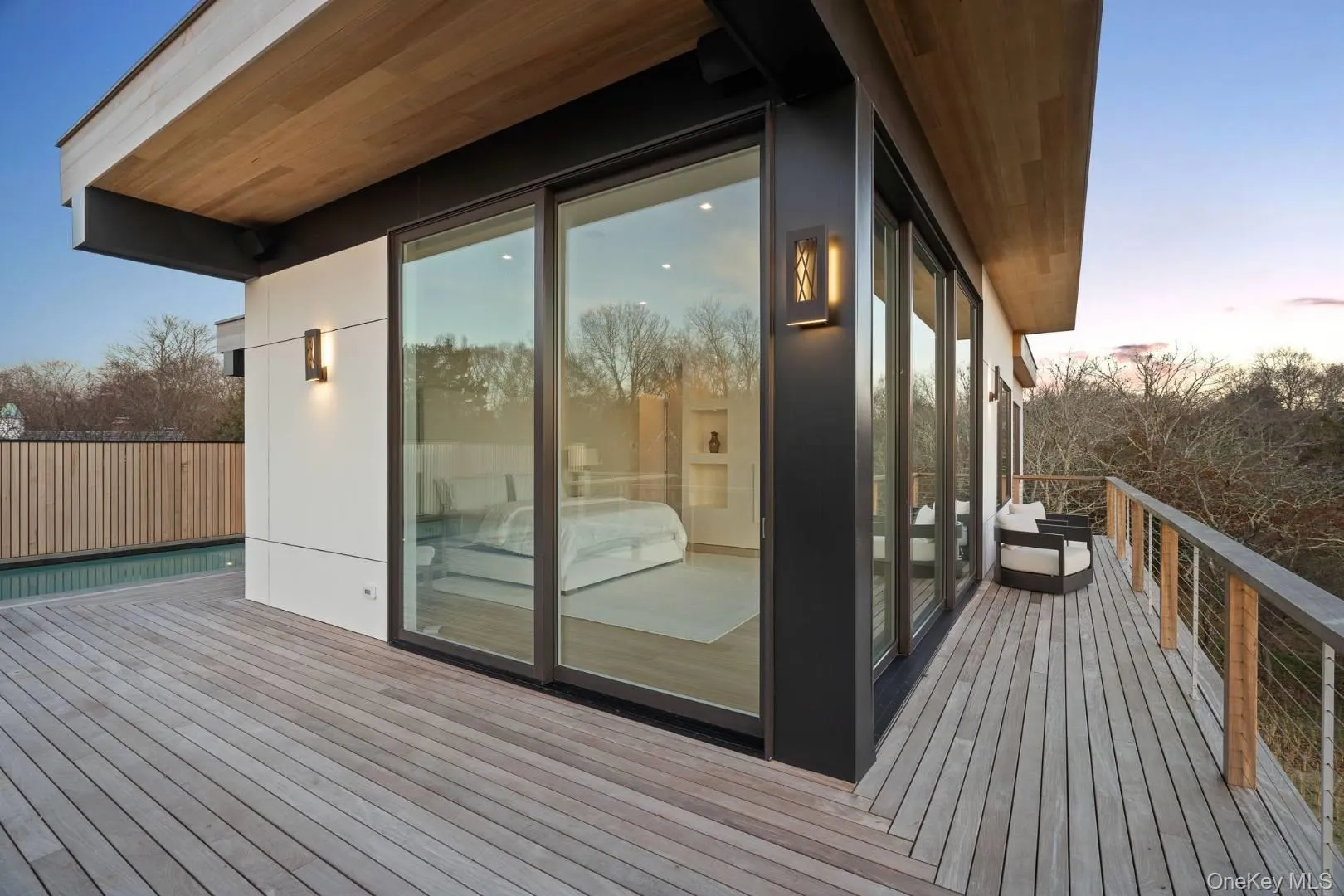 Deck at dusk with a swimming pool Deck at dusk with a swimming pool