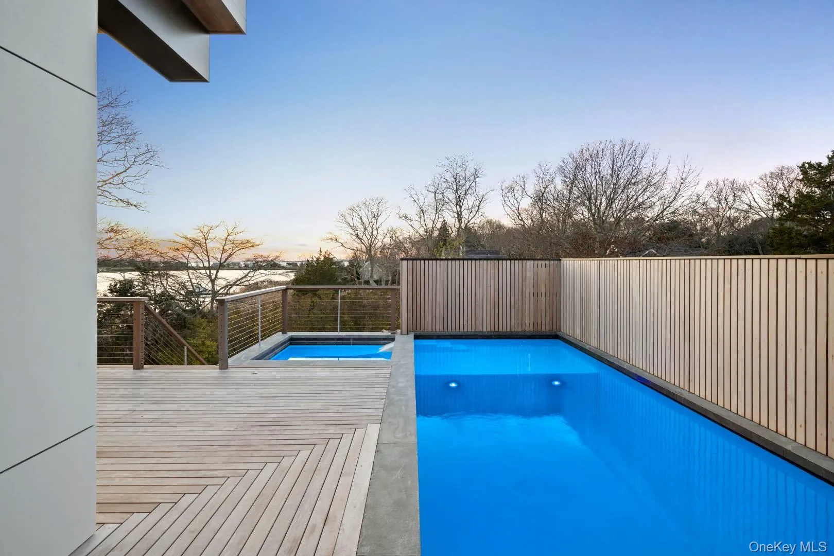 View of pool at dusk View of pool at dusk
