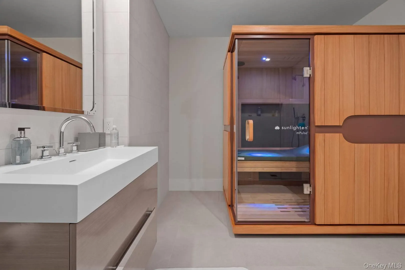 Bathroom with tile patterned flooring and vanity Bathroom with tile patterned flooring and vanity