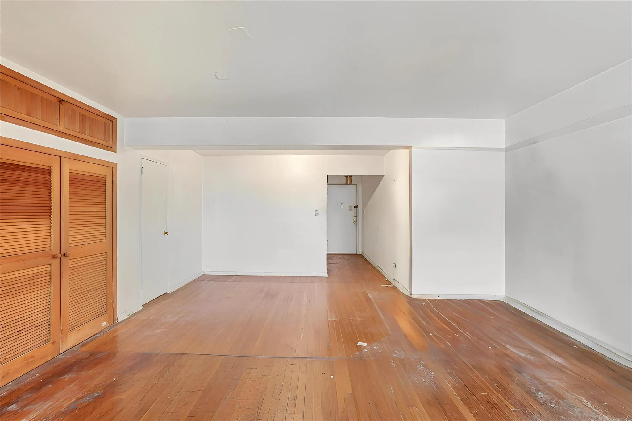 Empty room featuring hardwood / wood-style floors Empty room featuring hardwood / wood-style floors