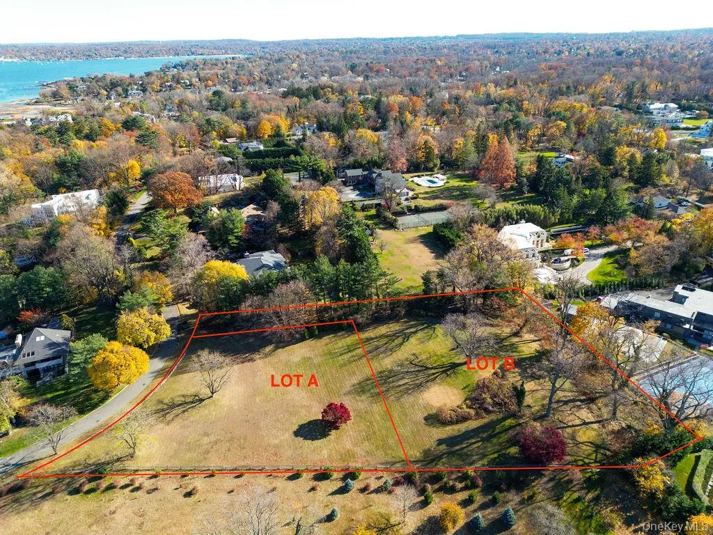 Birds eye view of property with a water view Birds eye view of property with a water view