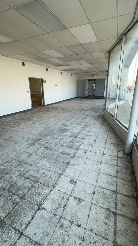 Empty room with a paneled ceiling Empty room with a paneled ceiling