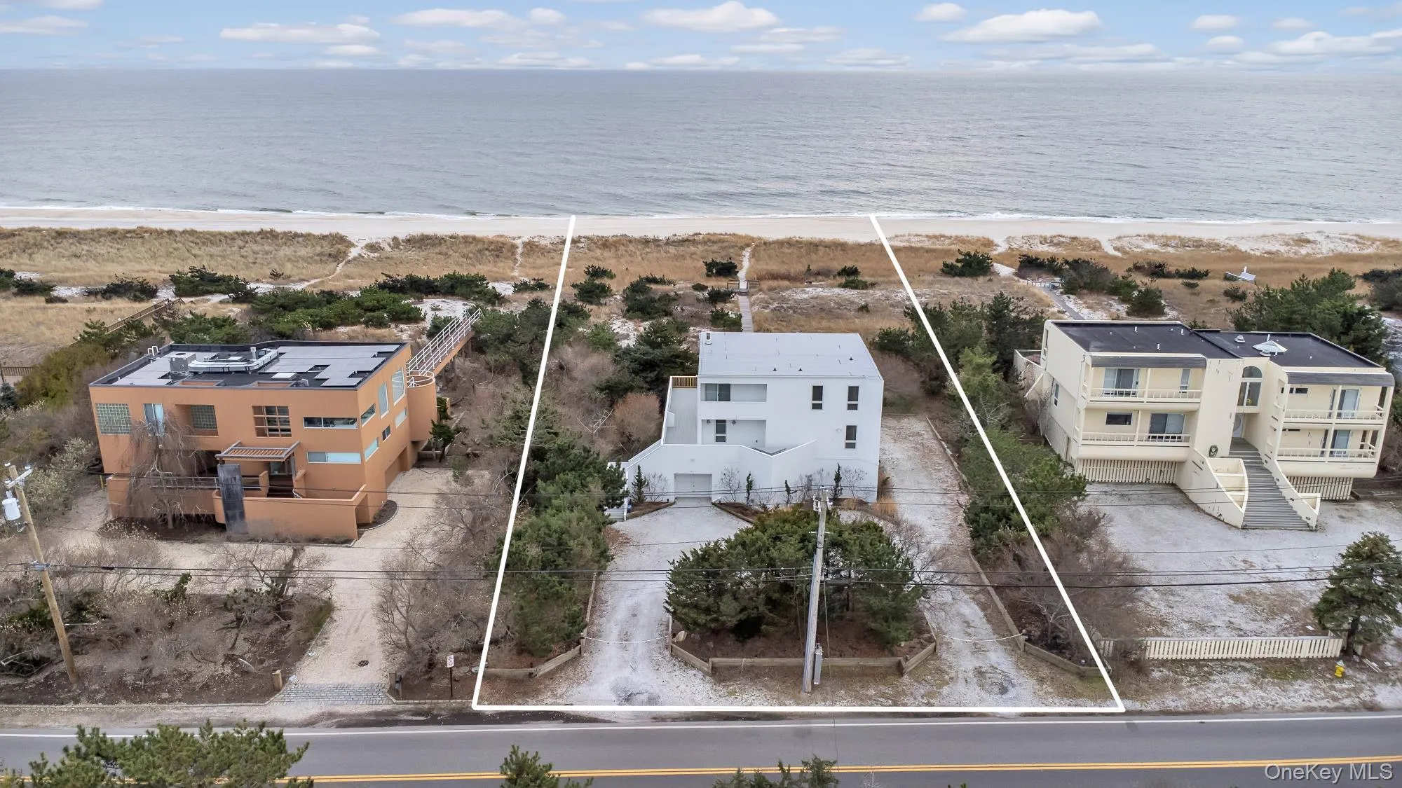 Drone / aerial view with a water view and a view of the beach Drone / aerial view with a water view and a view of the beach