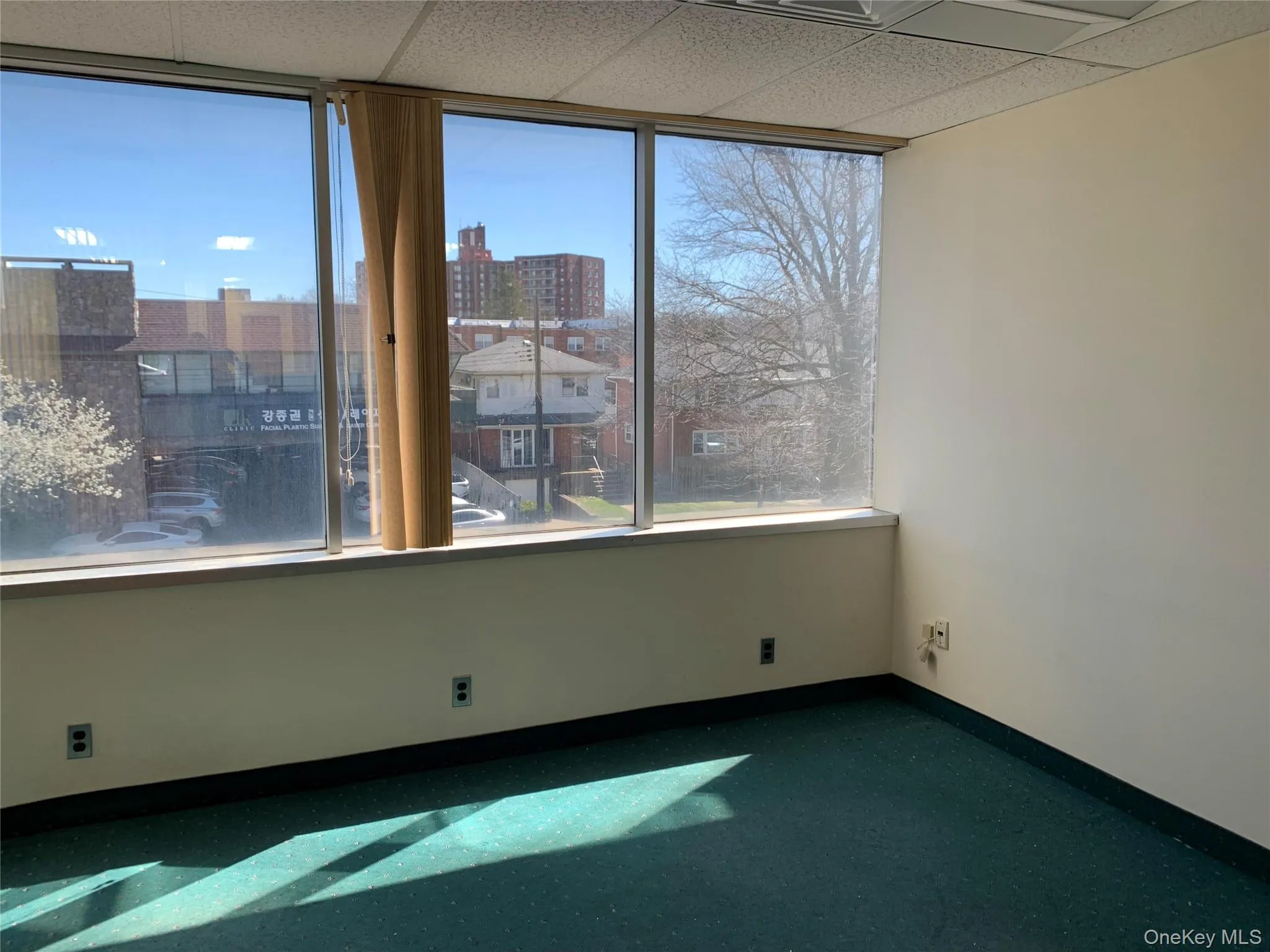 Unfurnished room featuring a paneled ceiling Unfurnished room featuring a paneled ceiling