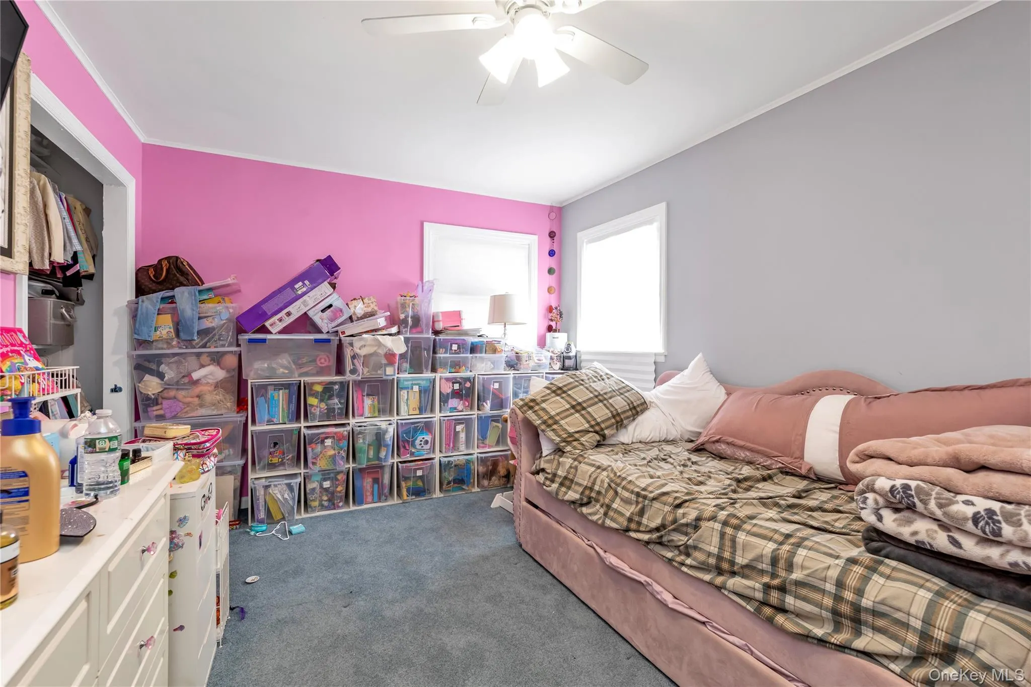 Bedroom featuring carpet, ceiling fan, and crown molding Bedroom featuring carpet, ceiling fan, and crown molding
