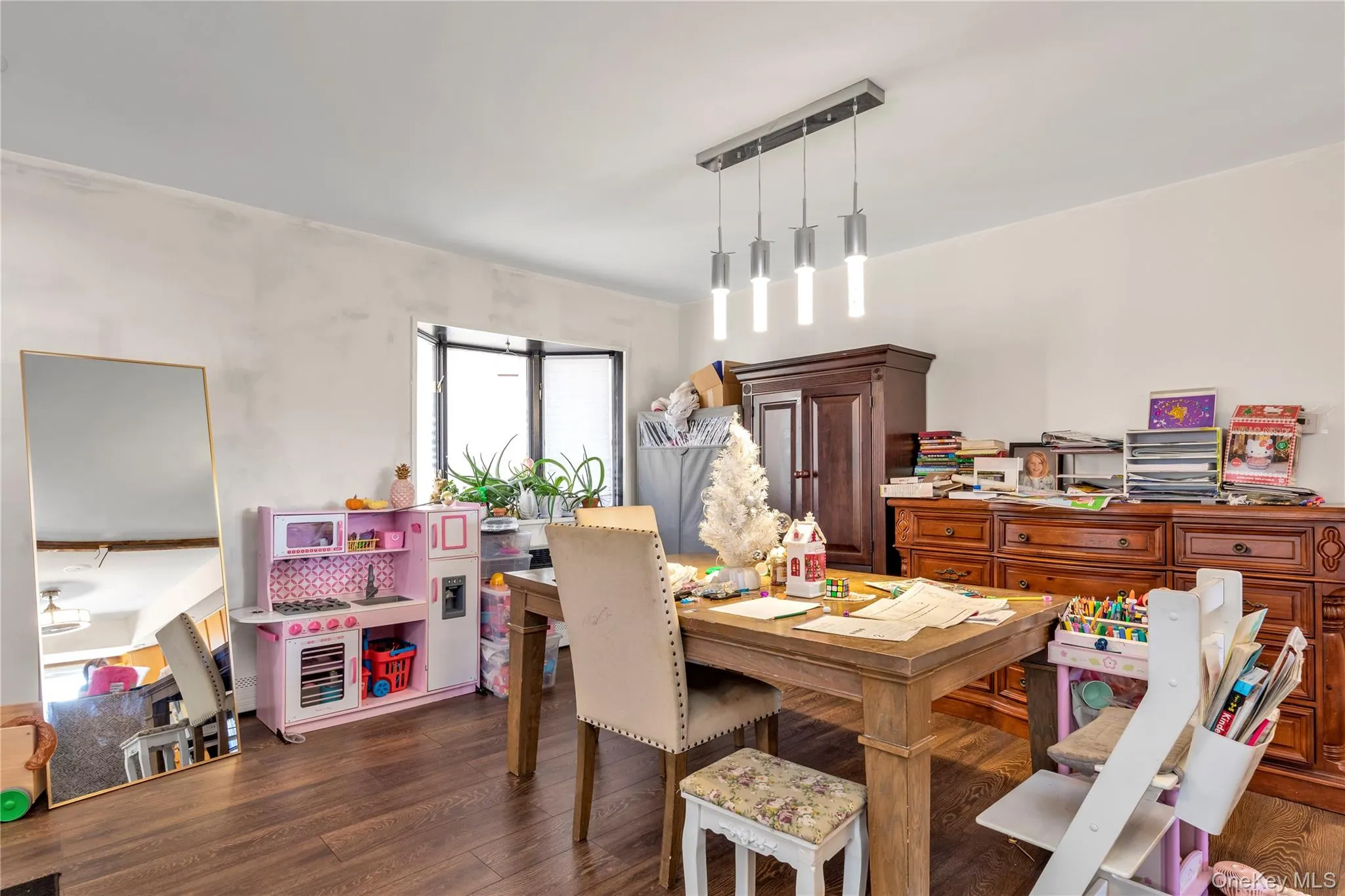Dining room with dark hardwood / wood-style floors Dining room with dark hardwood / wood-style floors