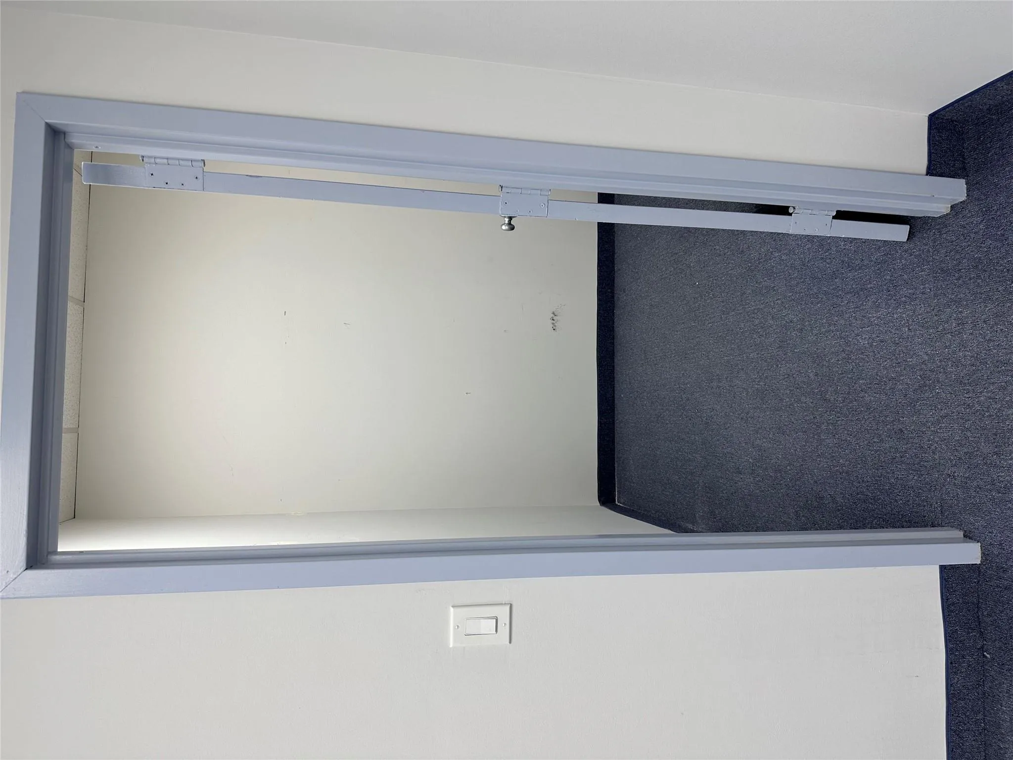 Hallway with dark carpet Hallway with dark carpet