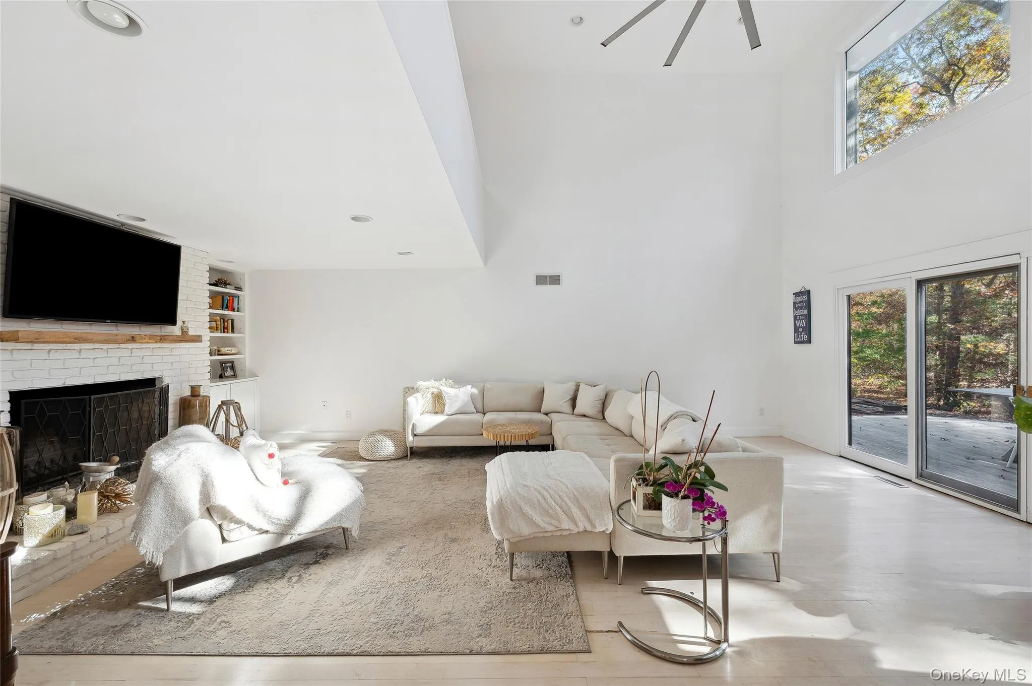 Living room with a fireplace and built in shelves Living room with a fireplace and built in shelves