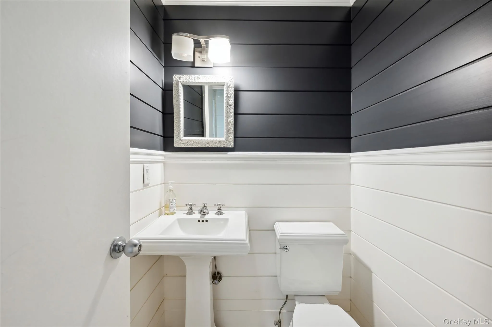 Bathroom with toilet and wooden walls Bathroom with toilet and wooden walls