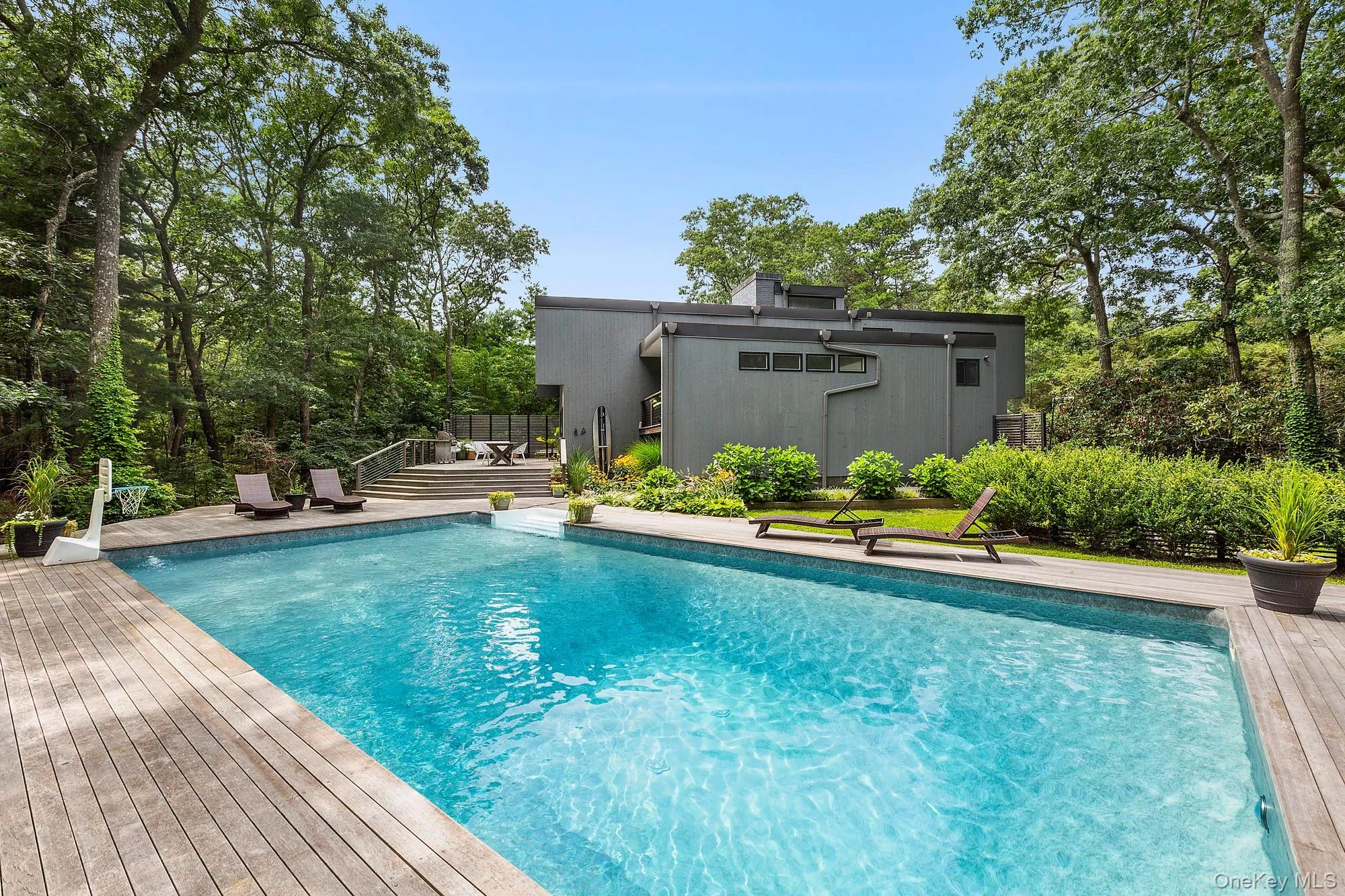View of swimming pool with a wooden deck View of swimming pool with a wooden deck