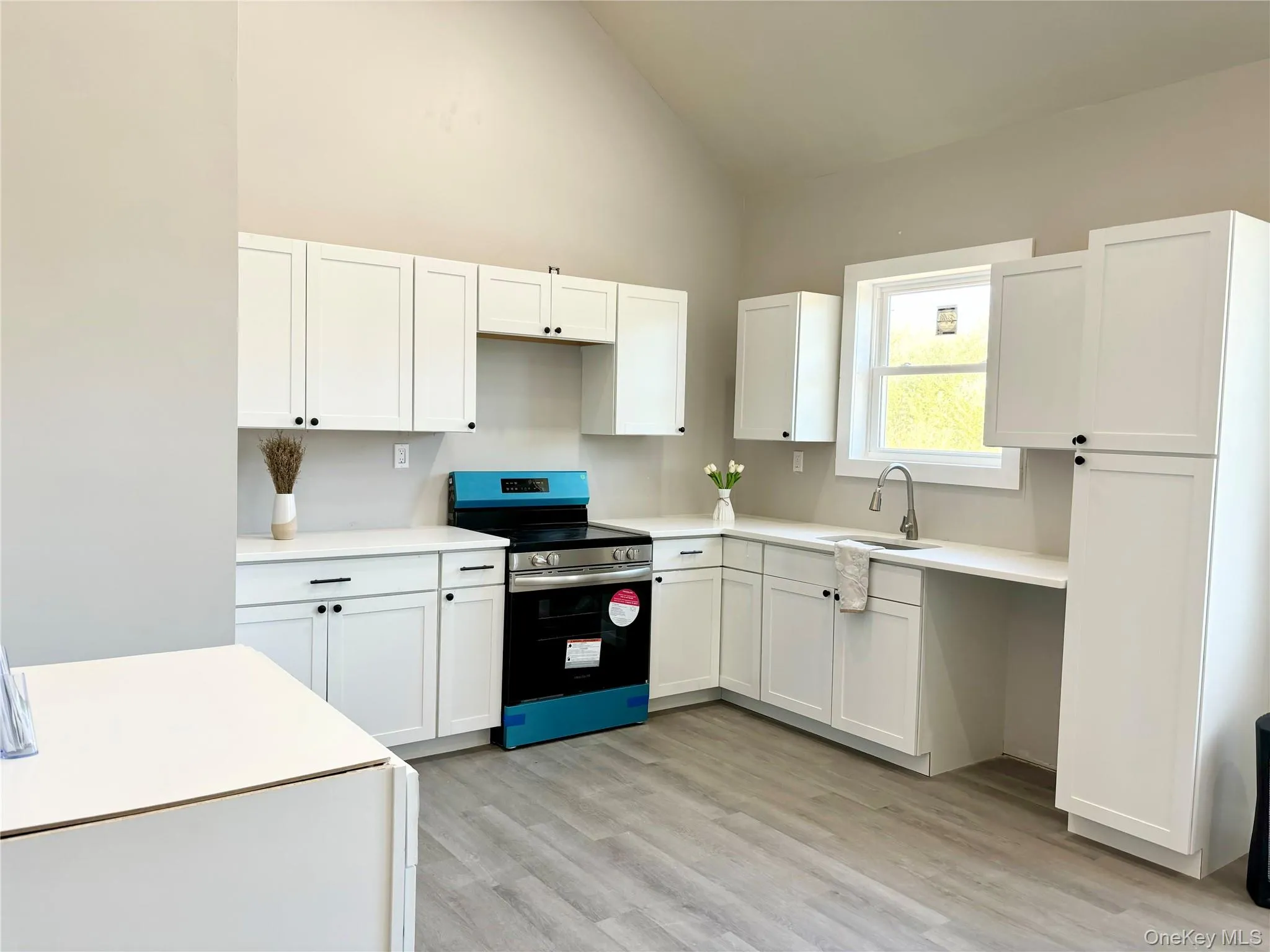 Kitchen with white cabinets, stainless steel appliances, dishwasher & refrigerator not installed yet Kitchen with white cabinets, stainless steel appliances, dishwasher & refrigerator not installed yet