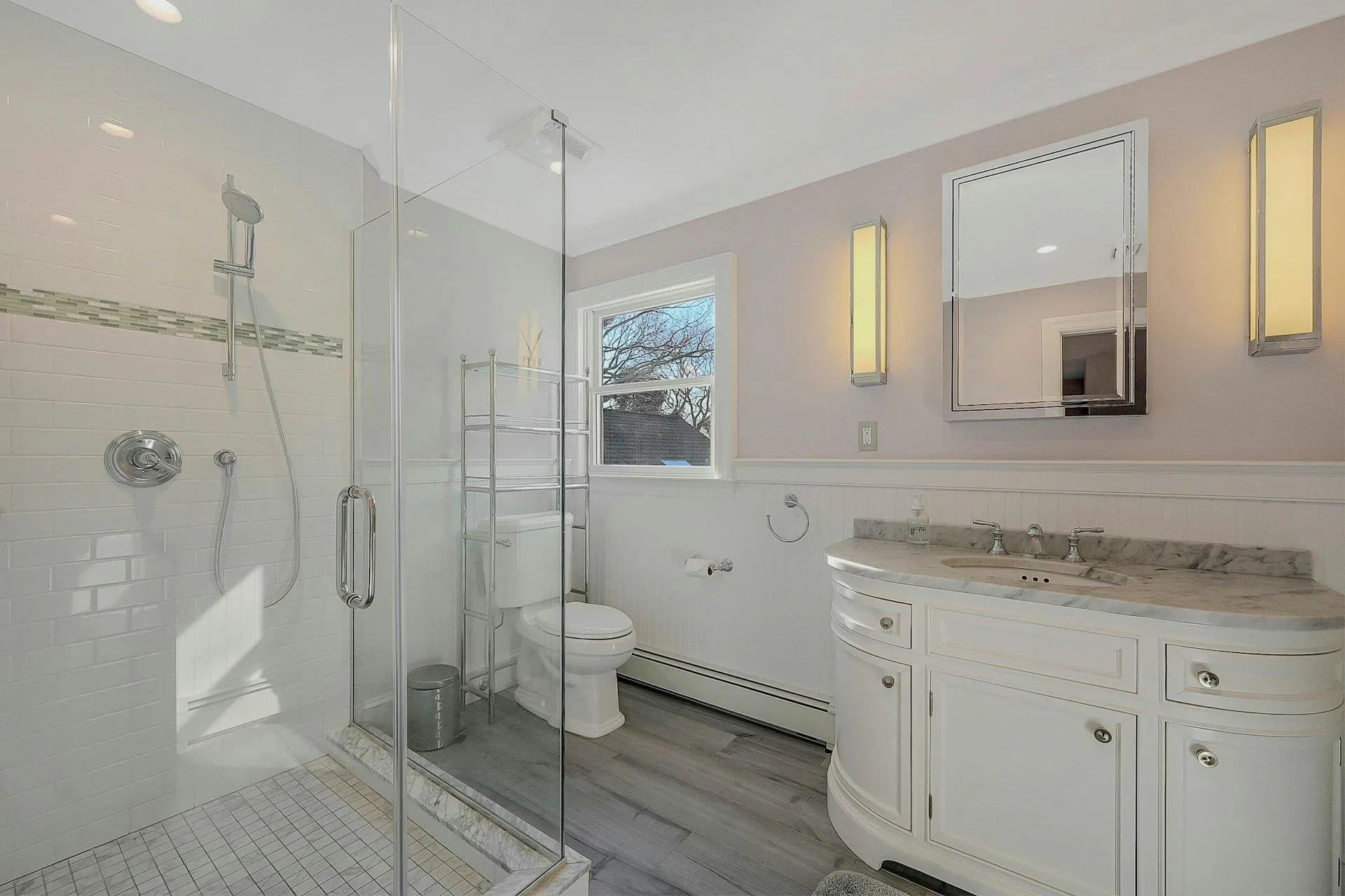 Bathroom with vanity, a shower with door, a baseboard radiator, hardwood / wood-style floors, and toilet Bathroom with vanity, a shower with door, a baseboard radiator, hardwood / wood-style floors, and toilet