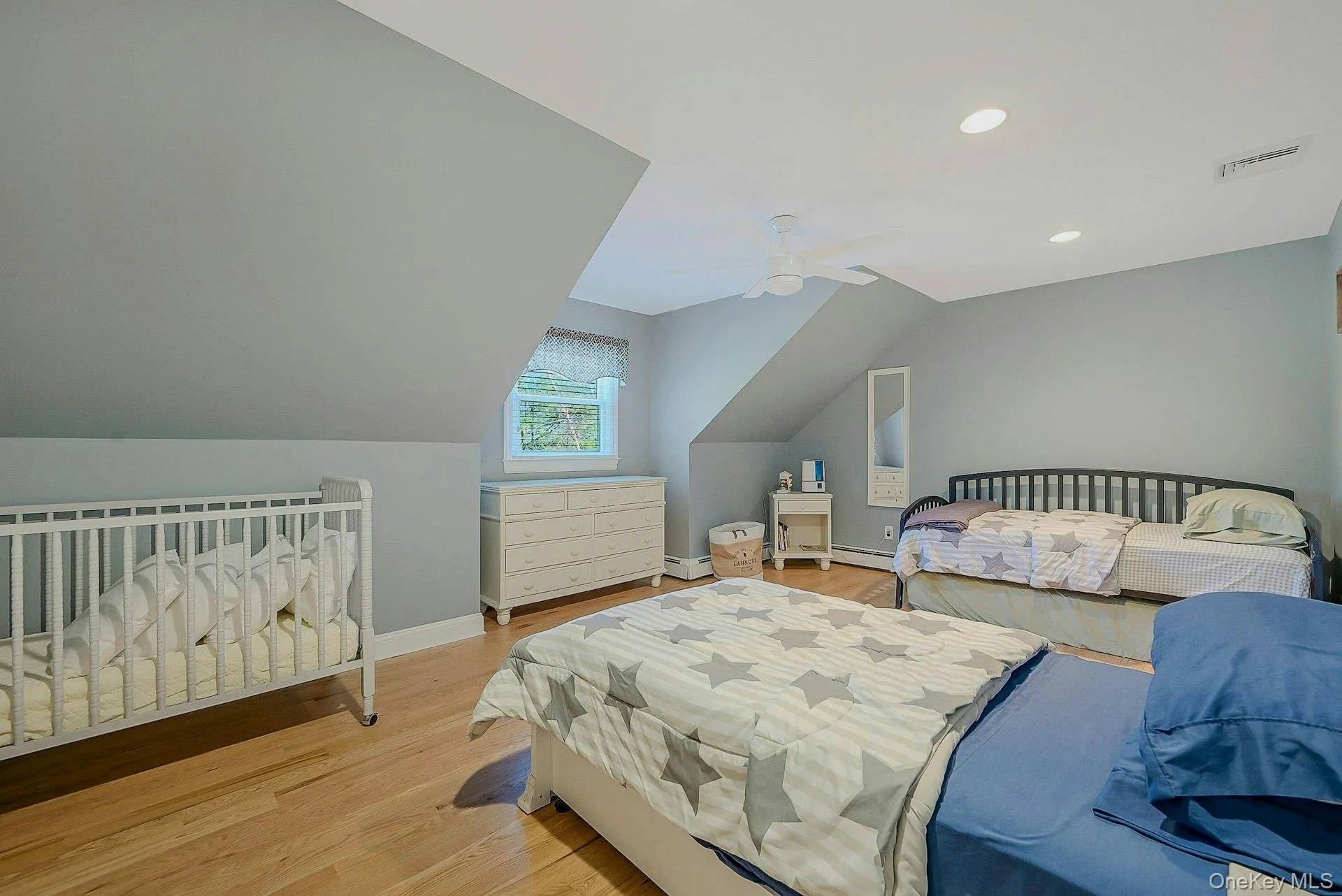 Two twin beds with trundles and a crib Two twin beds with trundles and a crib