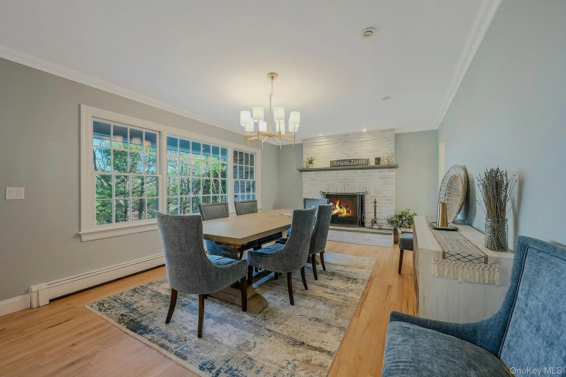 Dining room with fireplace and water view Dining room with fireplace and water view