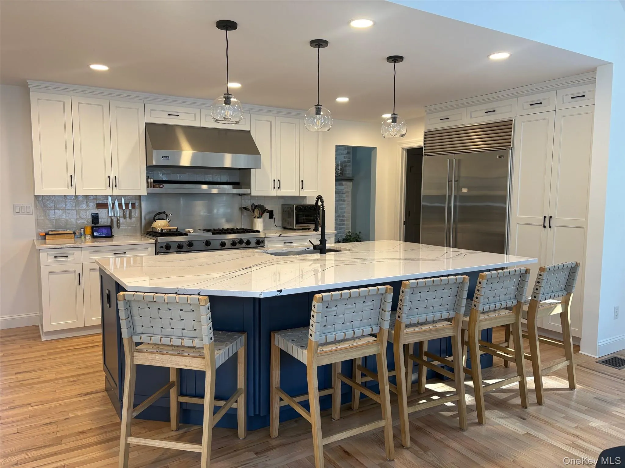 Kitchen featuring a spacious island and premium appliances Kitchen featuring a spacious island and premium appliances