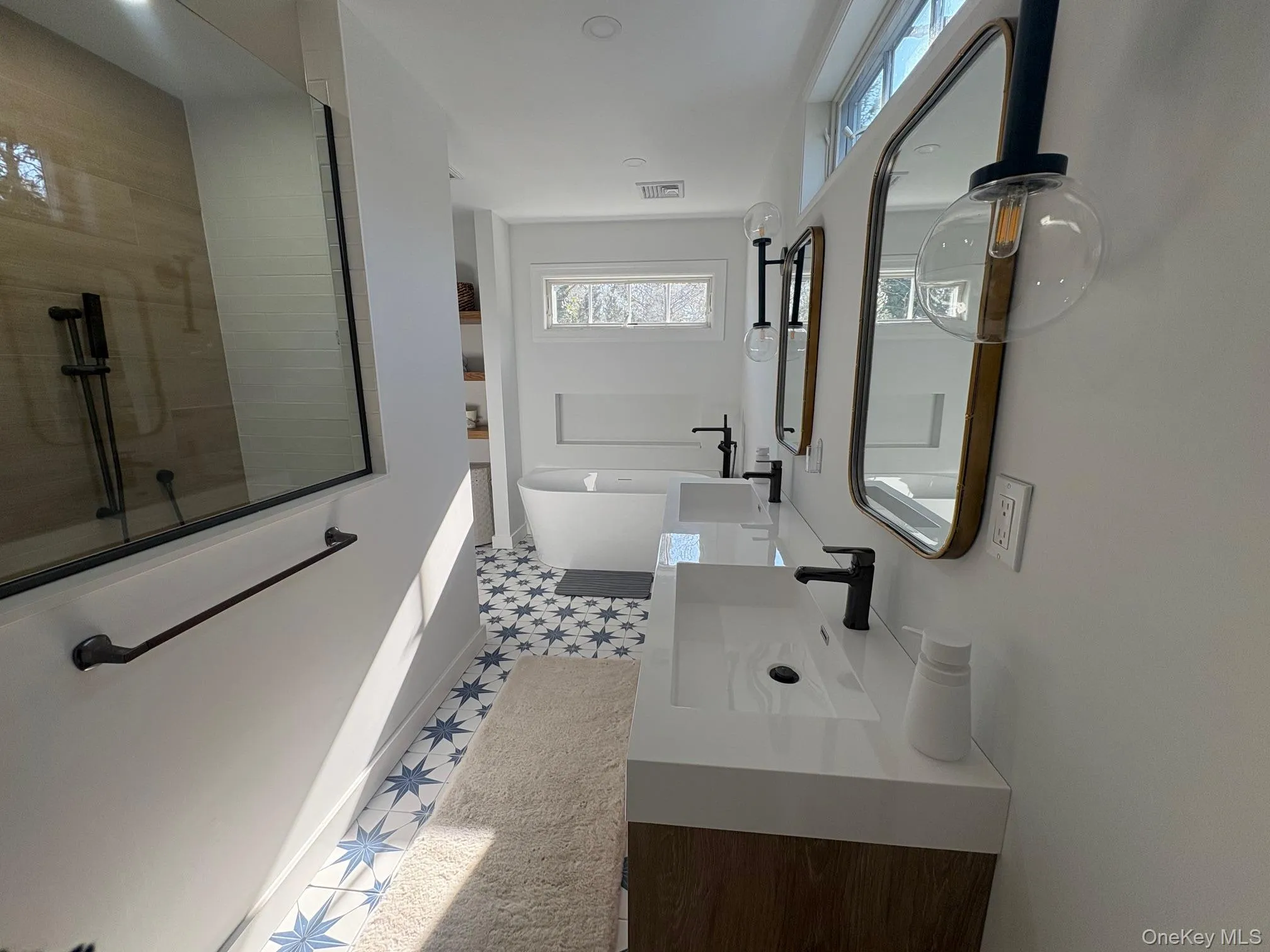 New primary bathroom with vanity and a soaking tub New primary bathroom with vanity and a soaking tub