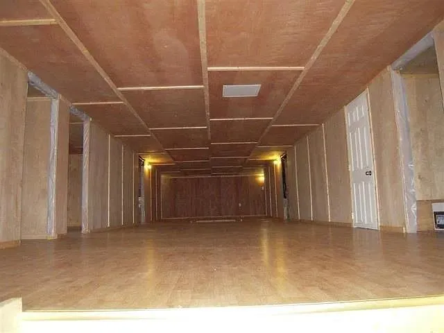 Misc room featuring hardwood / wood-style floors Misc room featuring hardwood / wood-style floors