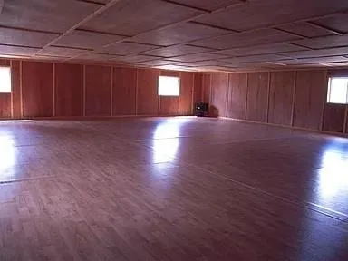 Basement featuring hardwood / wood-style flooring Basement featuring hardwood / wood-style flooring