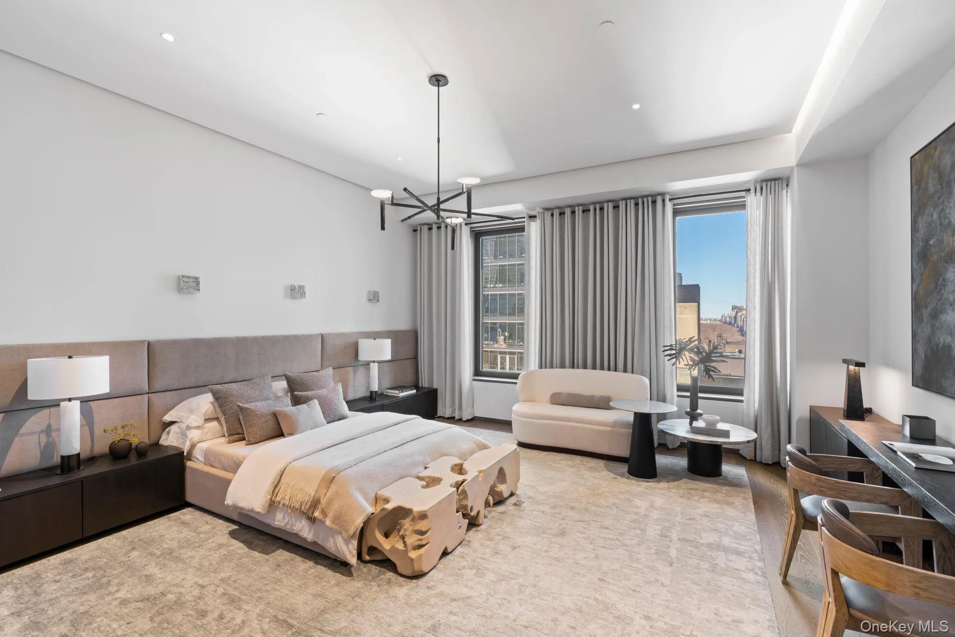Bedroom with an inviting chandelier and recessed lighting Bedroom with an inviting chandelier and recessed lighting