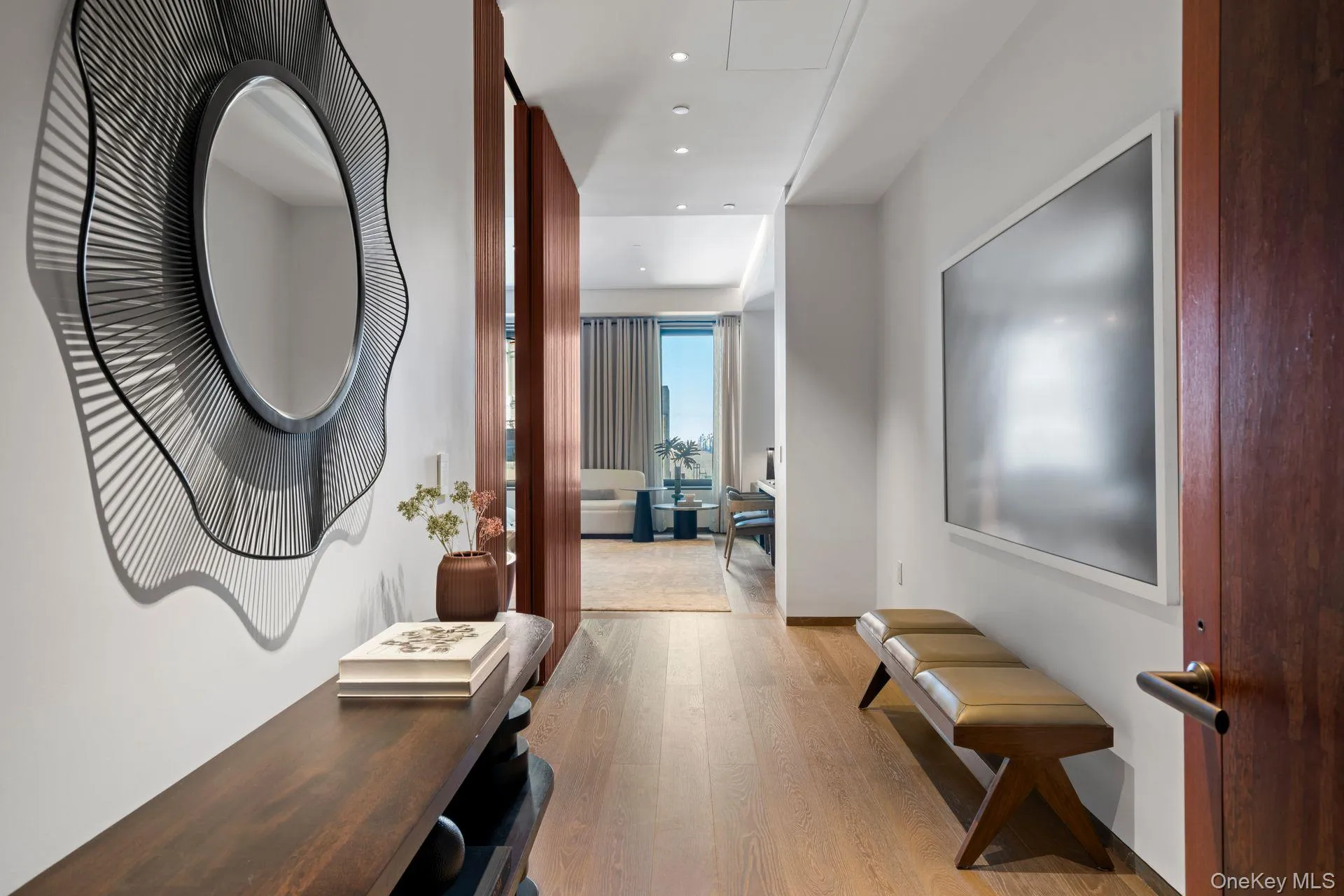 Hall with recessed lighting and light wood-style flooring Hall with recessed lighting and light wood-style flooring