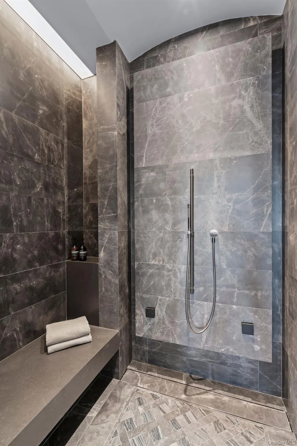 Full bathroom with a tile shower Full bathroom with a tile shower