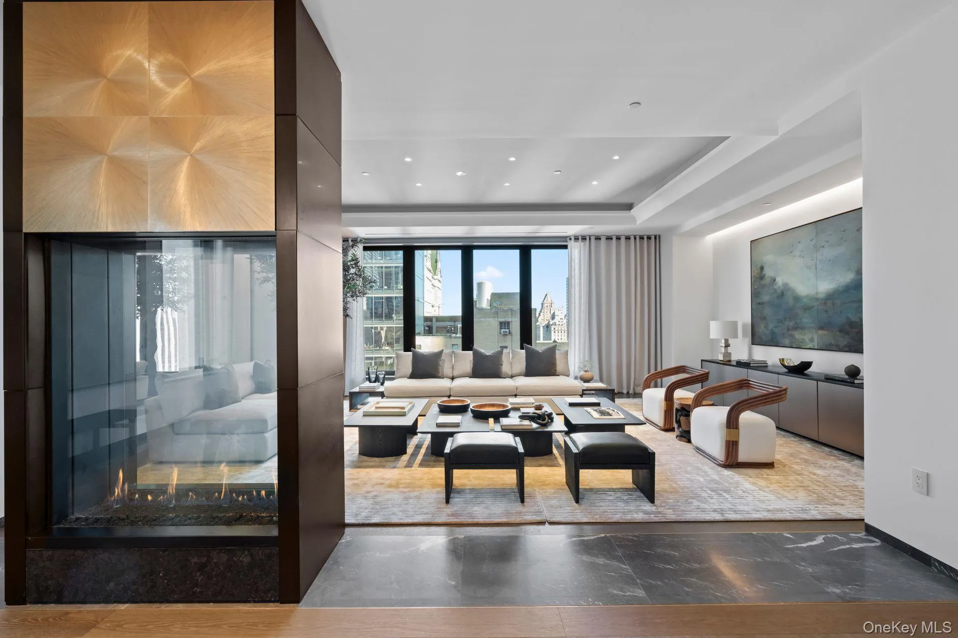 Living room with a raised ceiling and recessed lighting Living room with a raised ceiling and recessed lighting