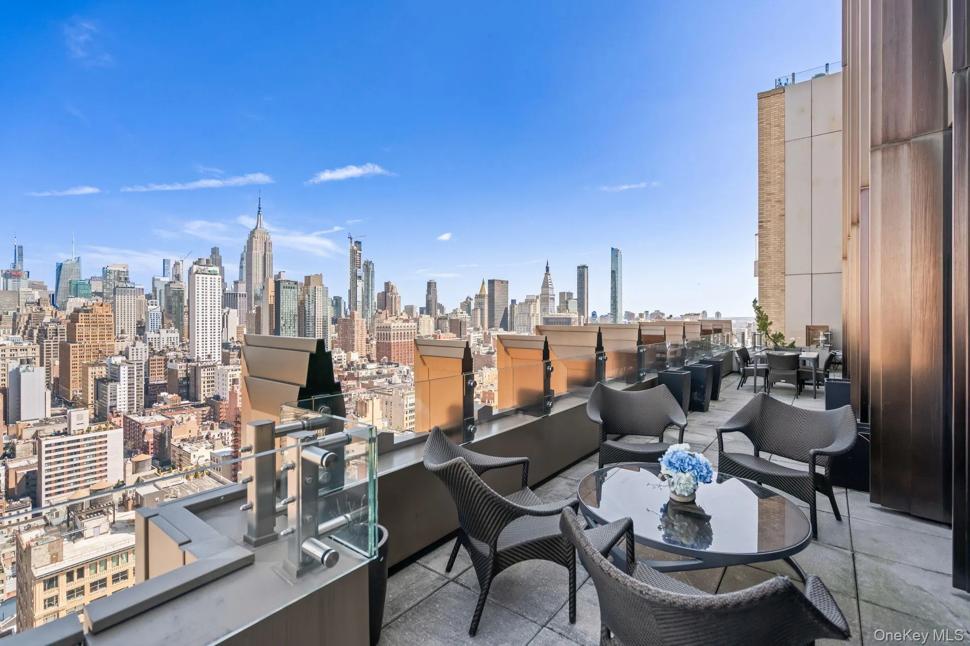 View of patio featuring a city view and a balcony View of patio featuring a city view and a balcony