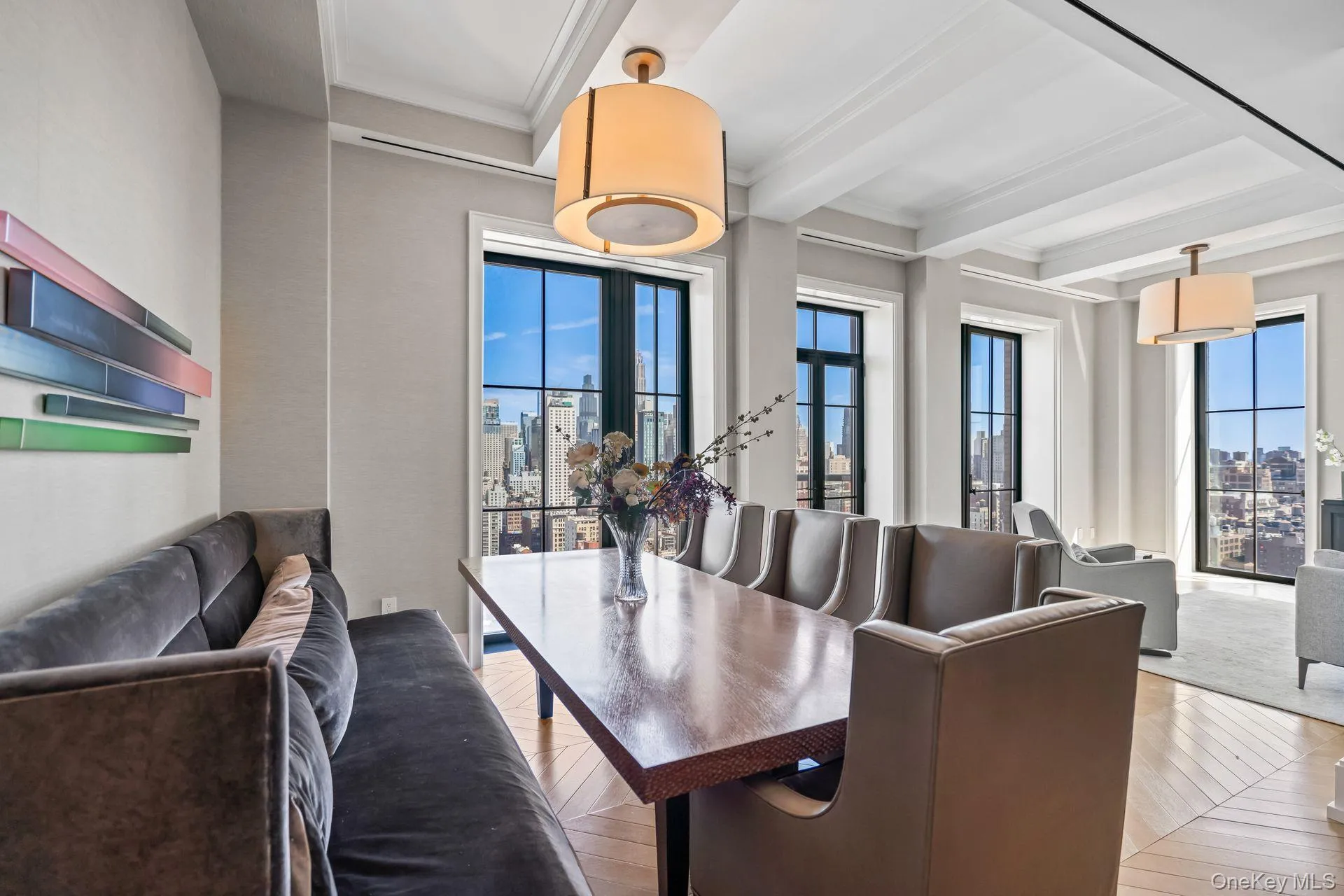 Dining space with plenty of natural light, a view of city, beam ceiling, and ornamental molding Dining space with plenty of natural light, a view of city, beam ceiling, and ornamental molding