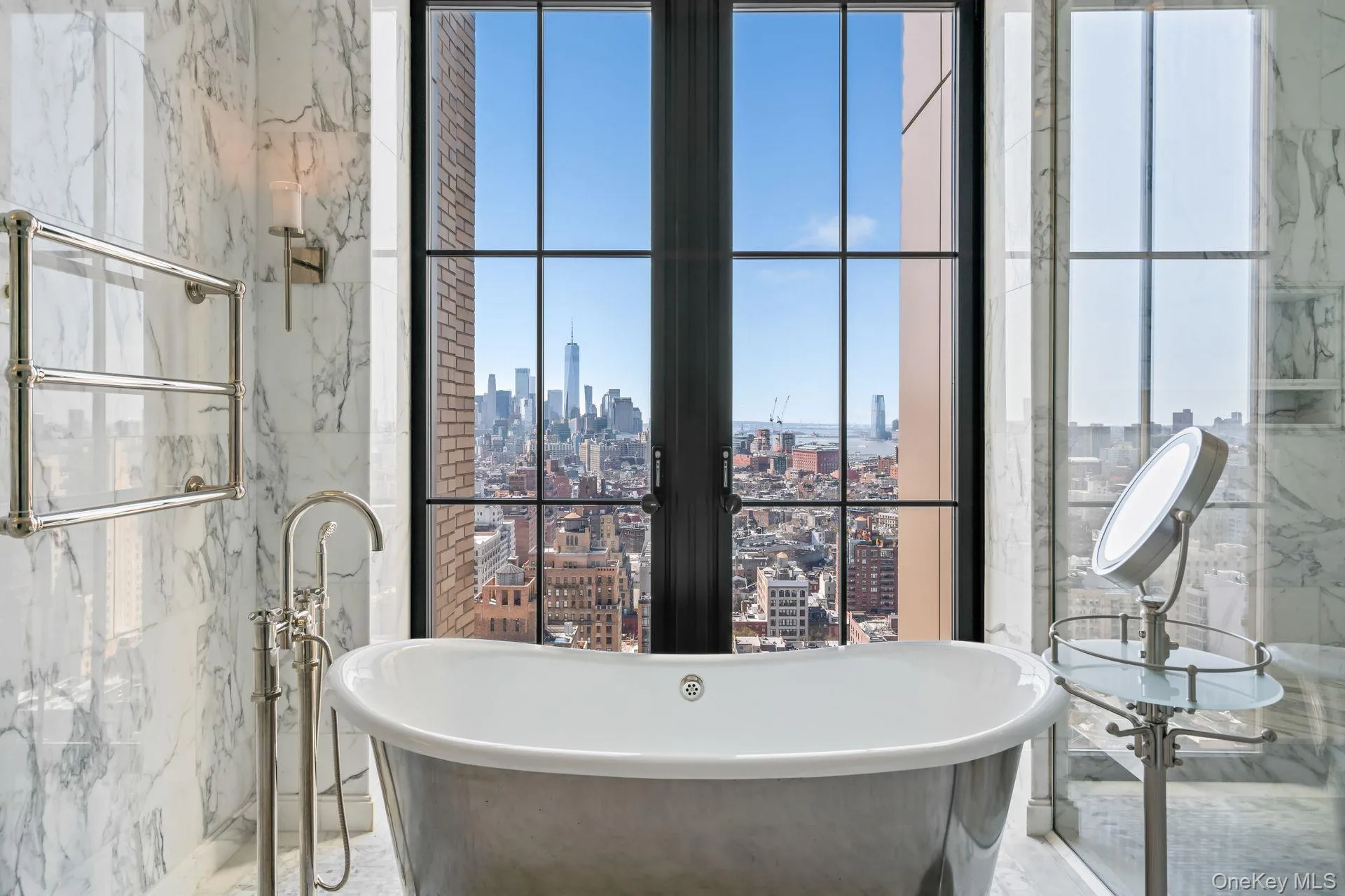 Bathroom featuring tile walls, a shower stall, a city view, and a freestanding bath Bathroom featuring tile walls, a shower stall, a city view, and a freestanding bath